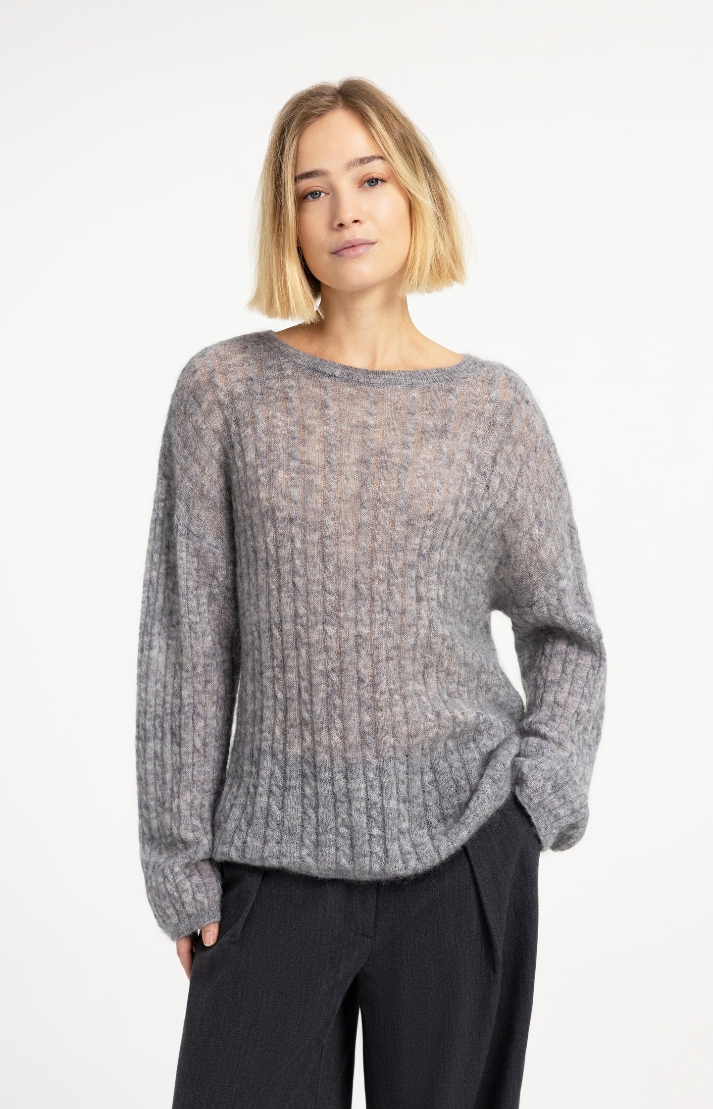 Oversized cable sweater with boat neckline