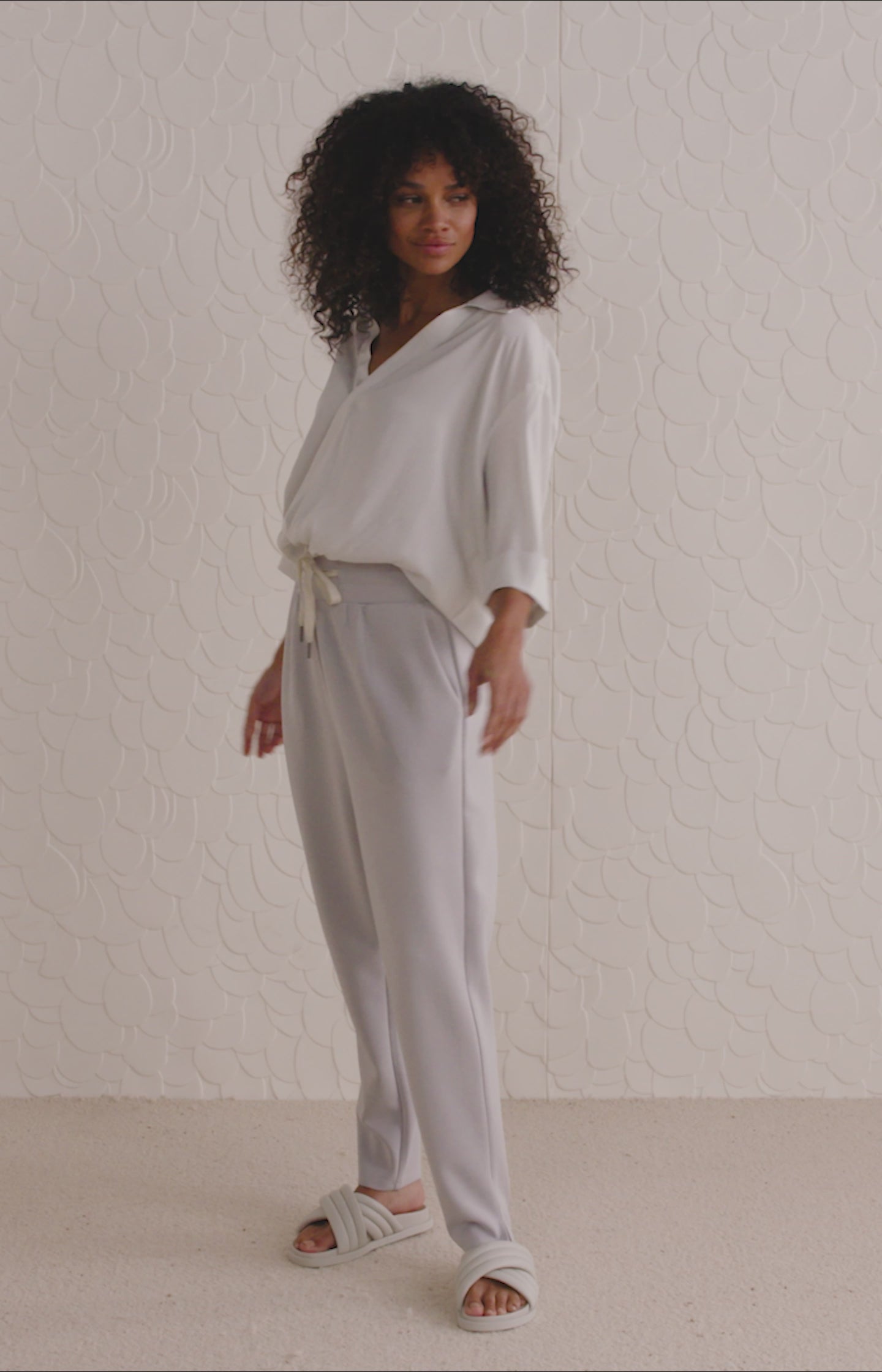 Top with V-neck, 3/4 length sleeves and draped details