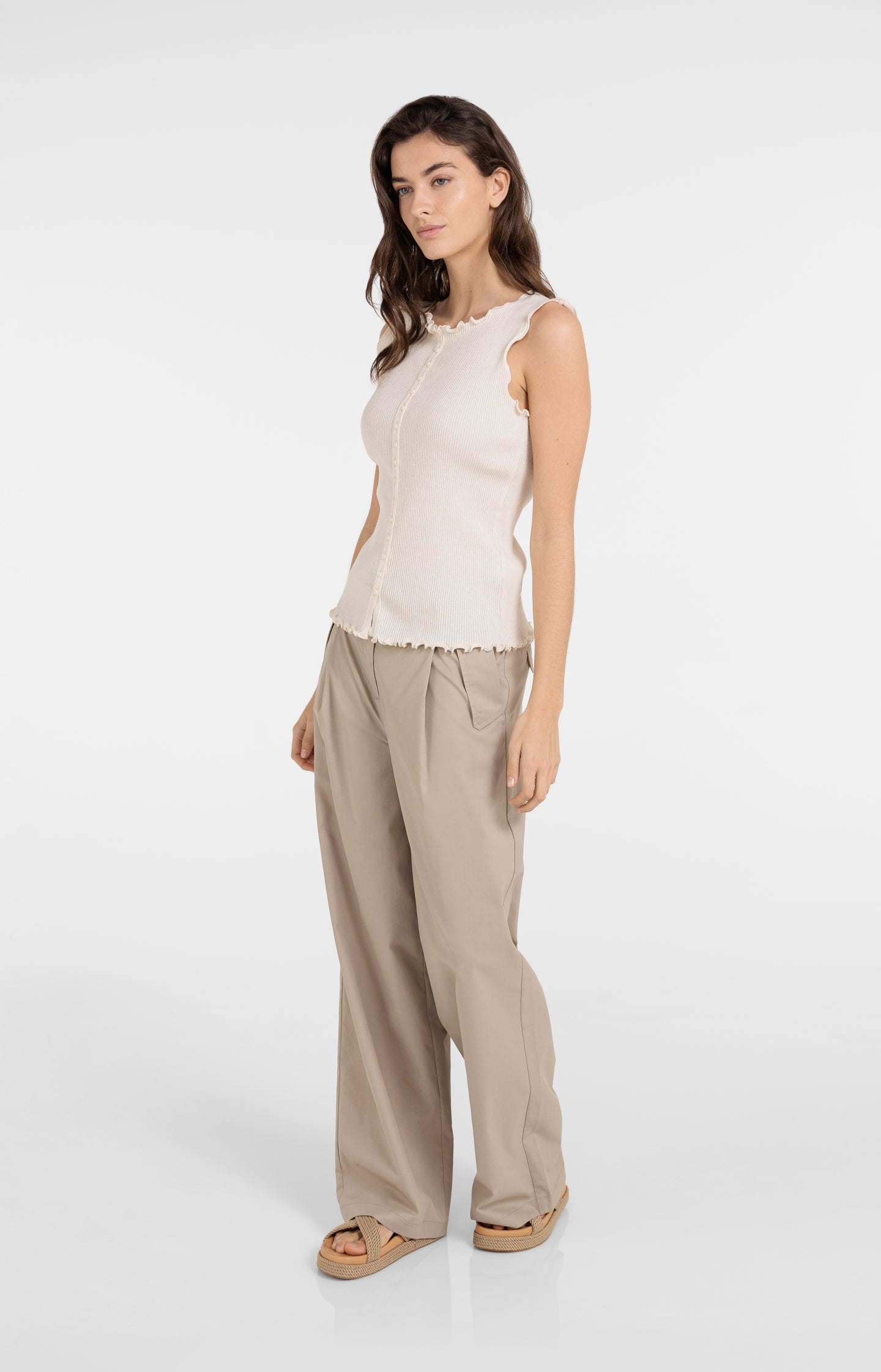 Ribbed sleeveless top with ruffled edges