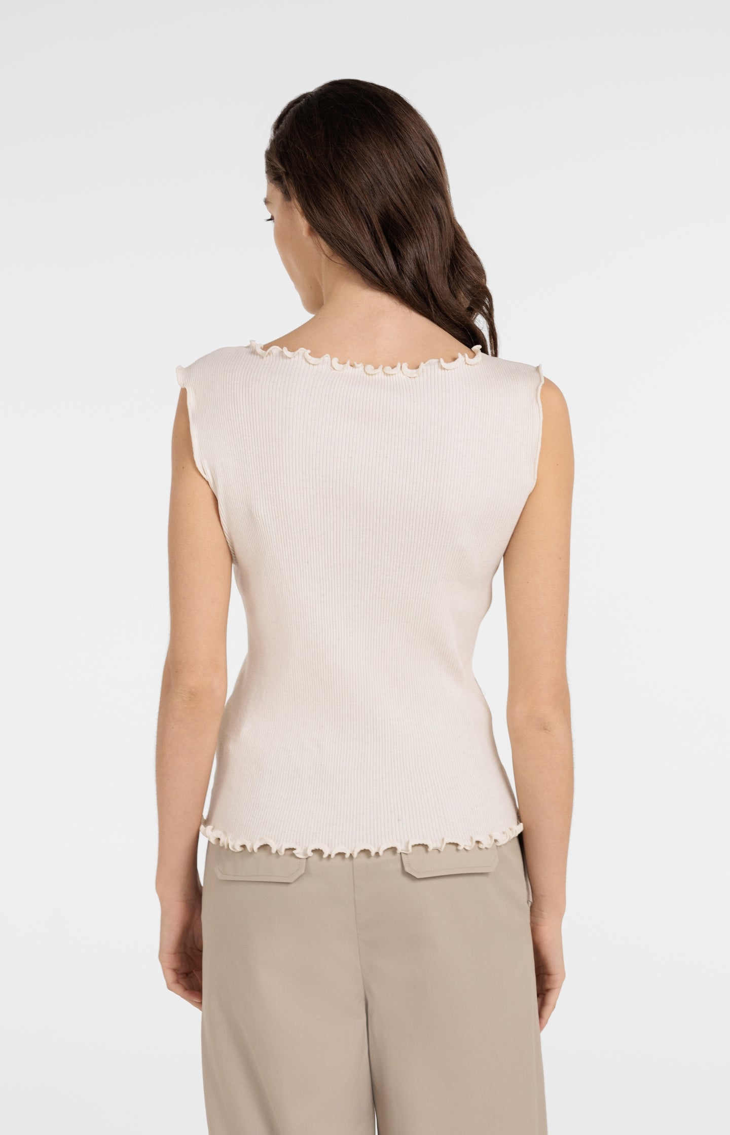 Ribbed sleeveless top with ruffled edges