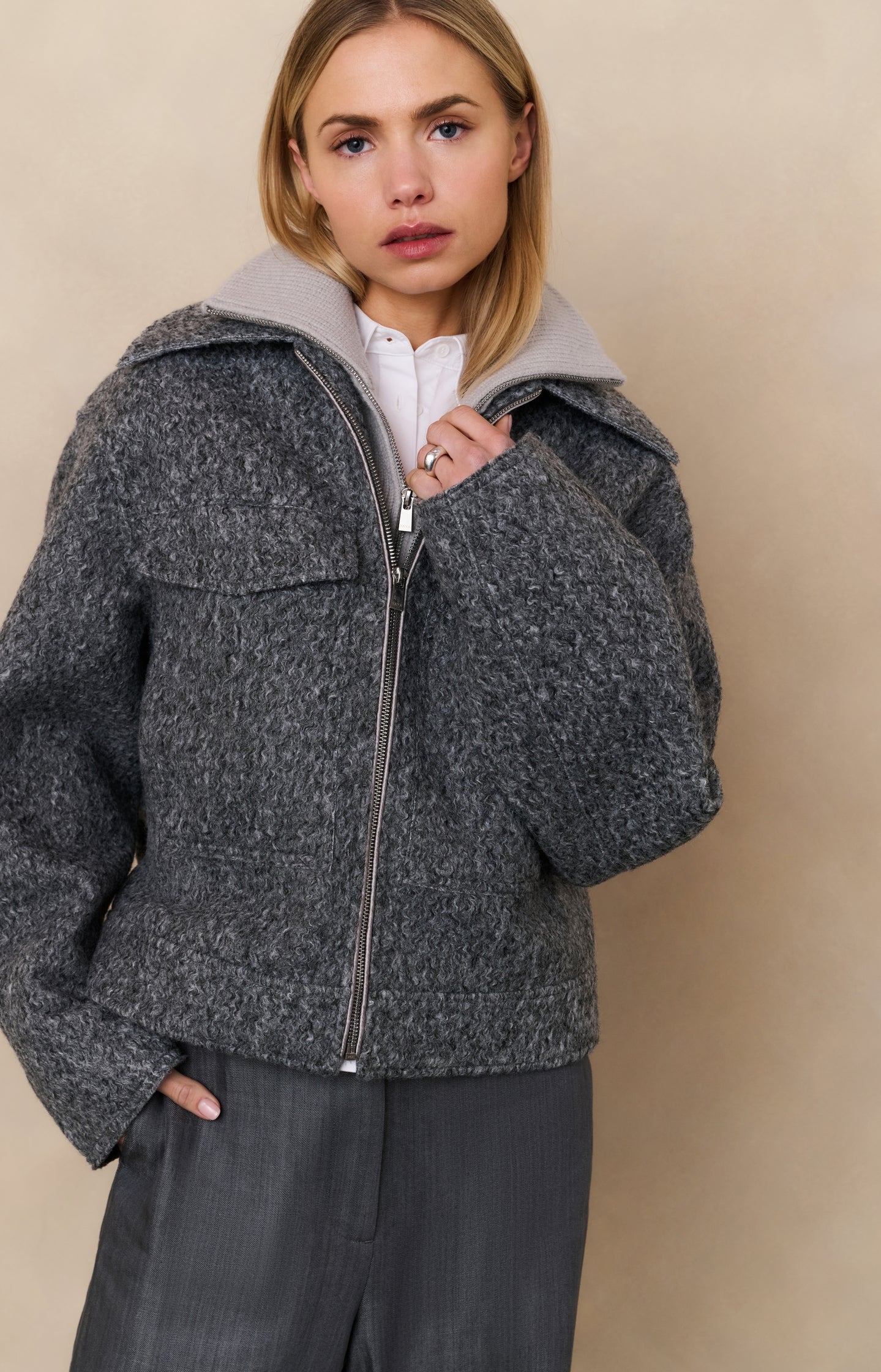 Short bouclé jacket with zip and stand-up collar