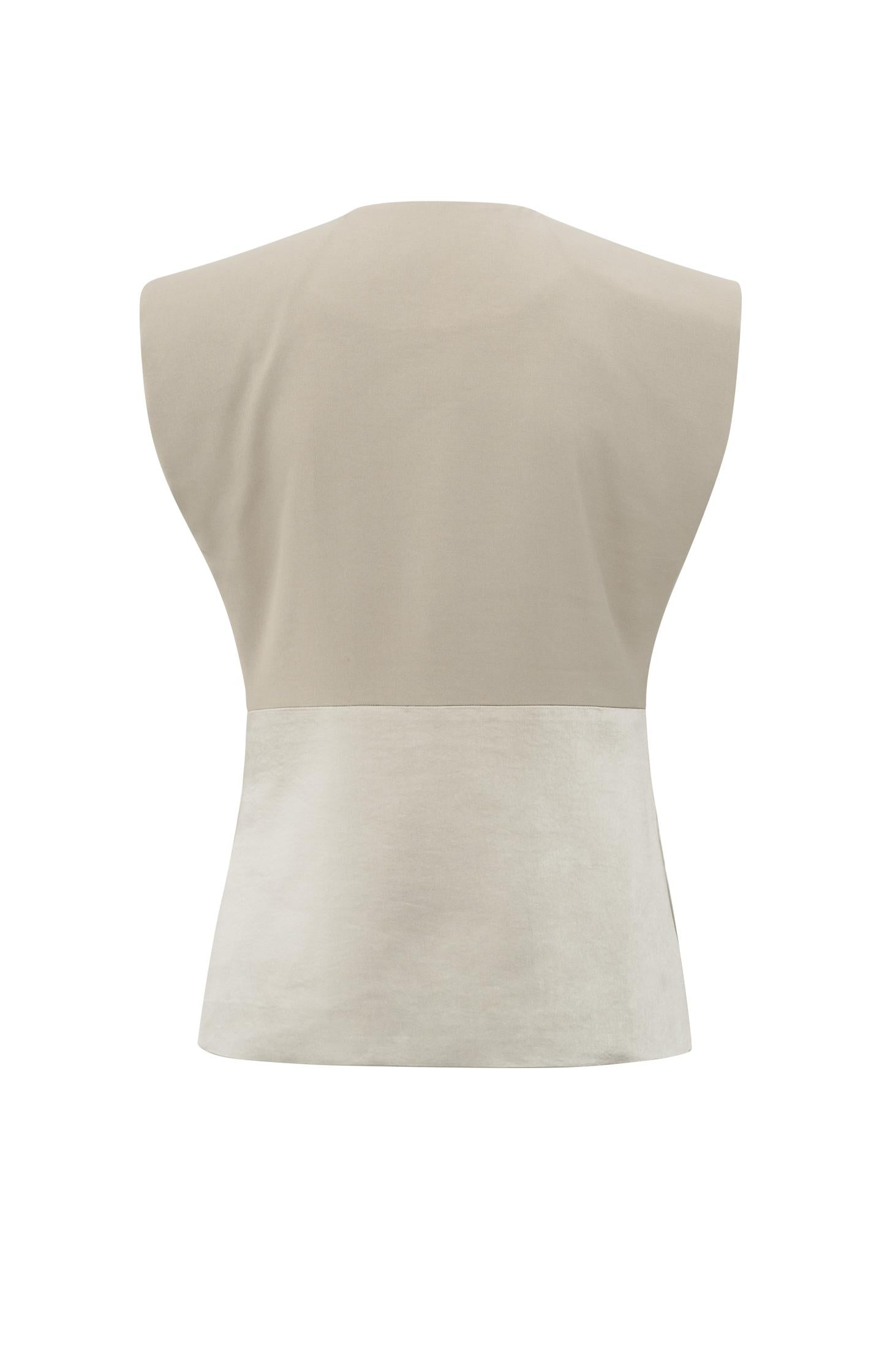 Sleeveless blazer with satin details
