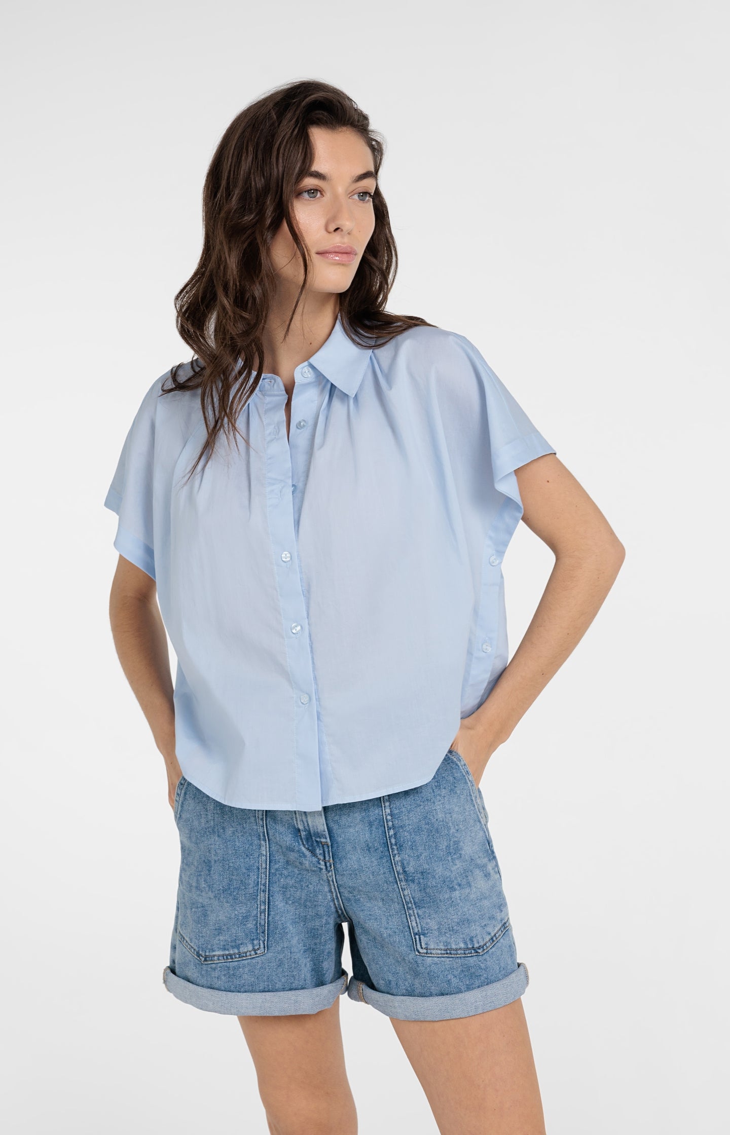 Sleeveless blouse with button details