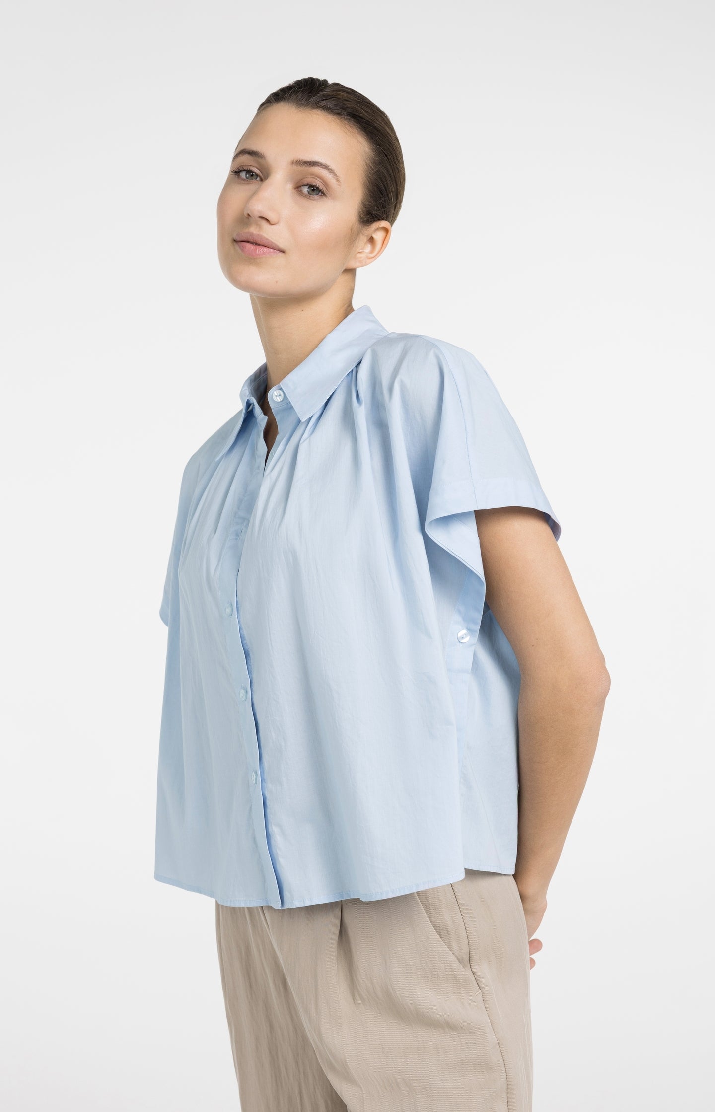 Sleeveless blouse with button details