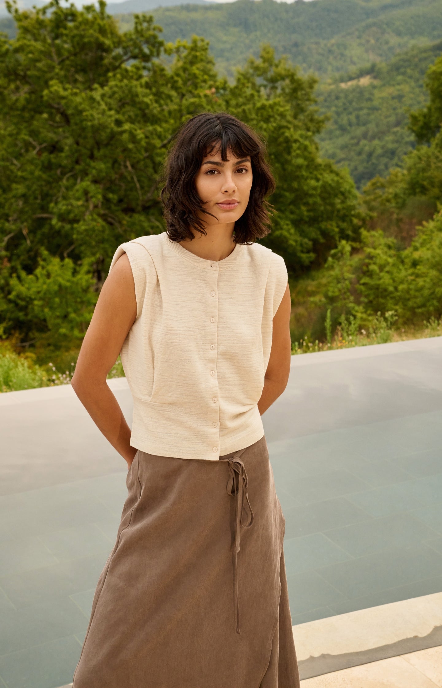 Sleeveless cardigan with shoulder detail and buttons