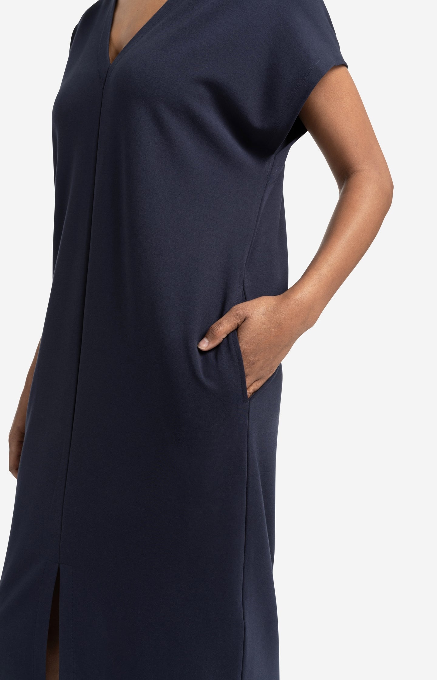 Sleeveless dress with double V-neck and front slit