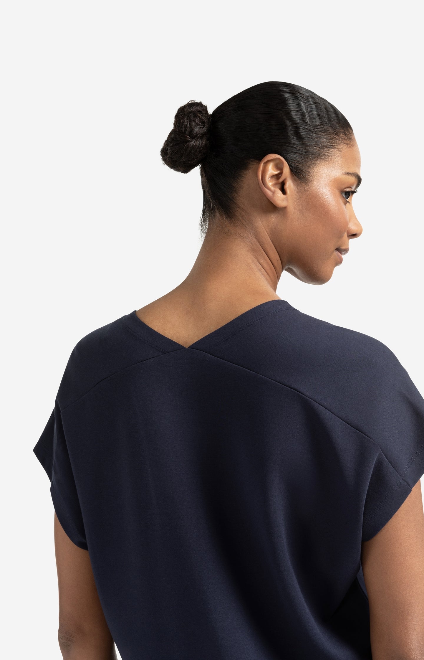 Sleeveless dress with double V-neck and front slit