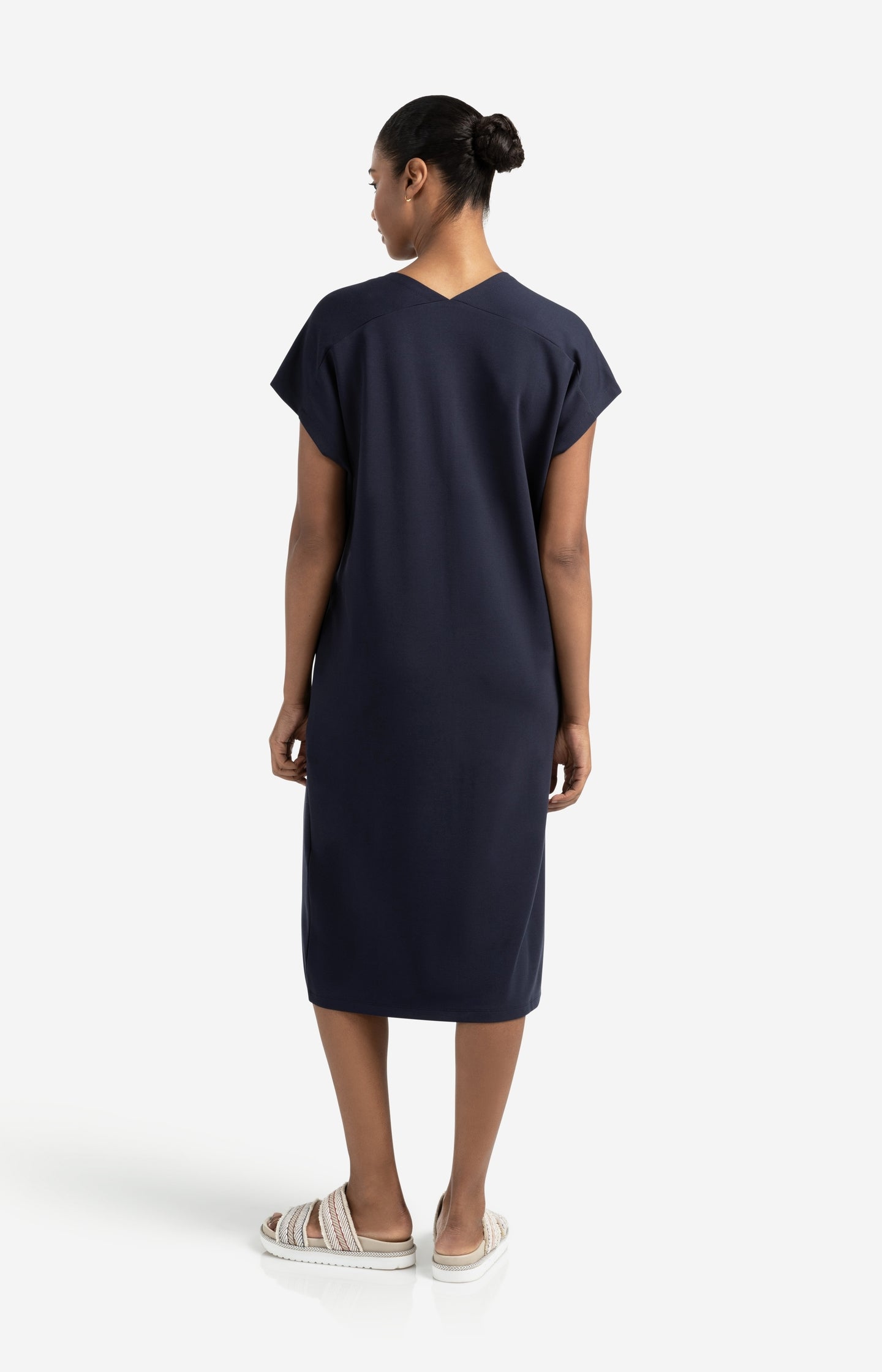 Sleeveless dress with double V-neck and front slit