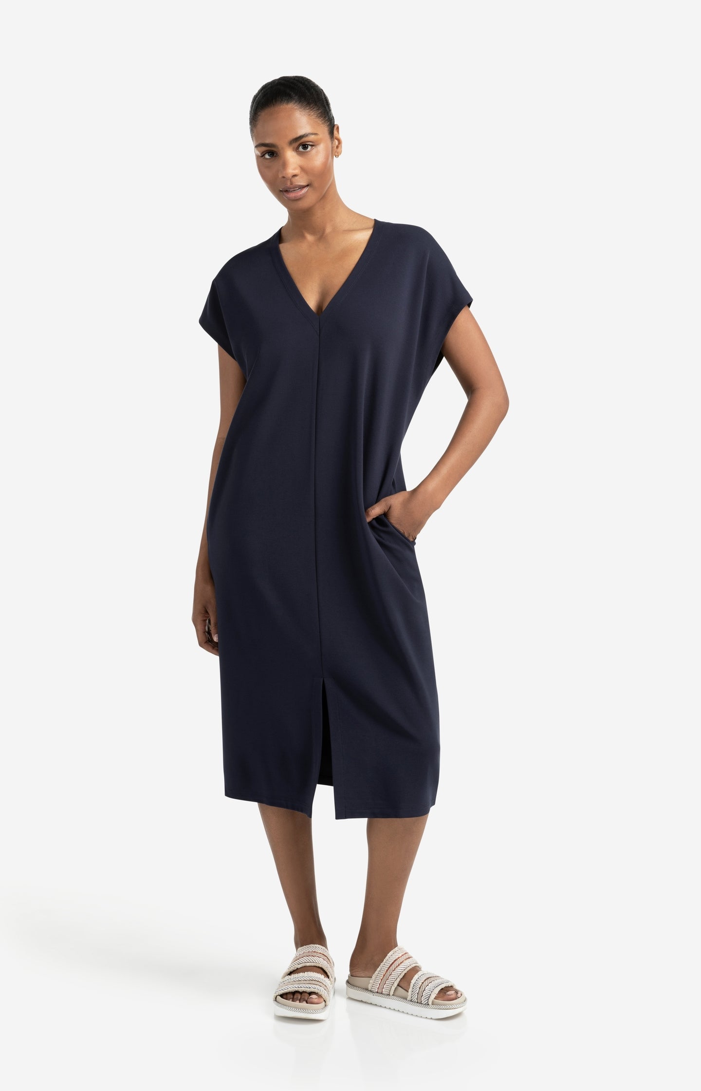 Sleeveless dress with double V-neck and front slit