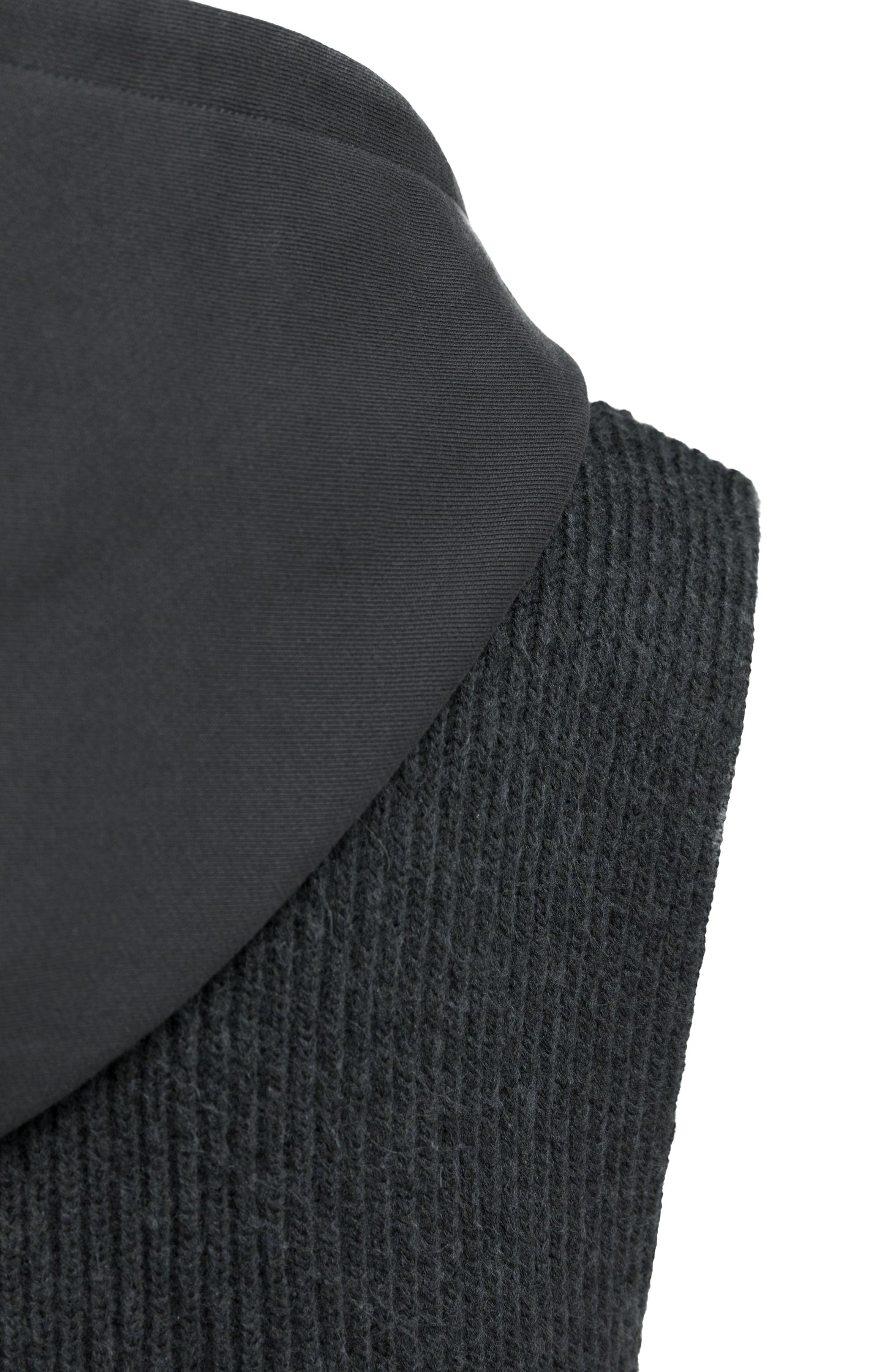 Sleeveless knitted top with jersey hood