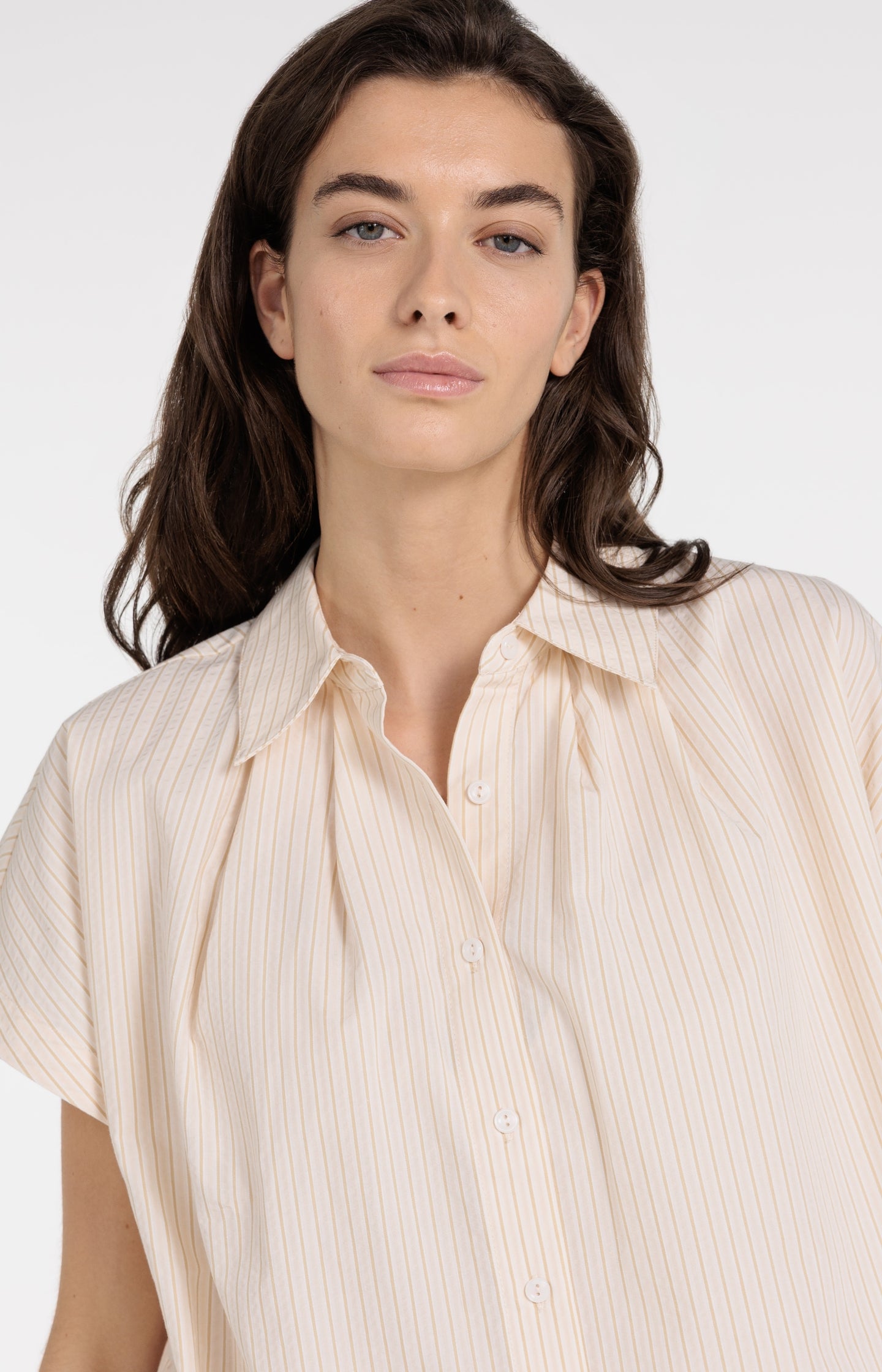 Sleeveless striped blouse with button detail