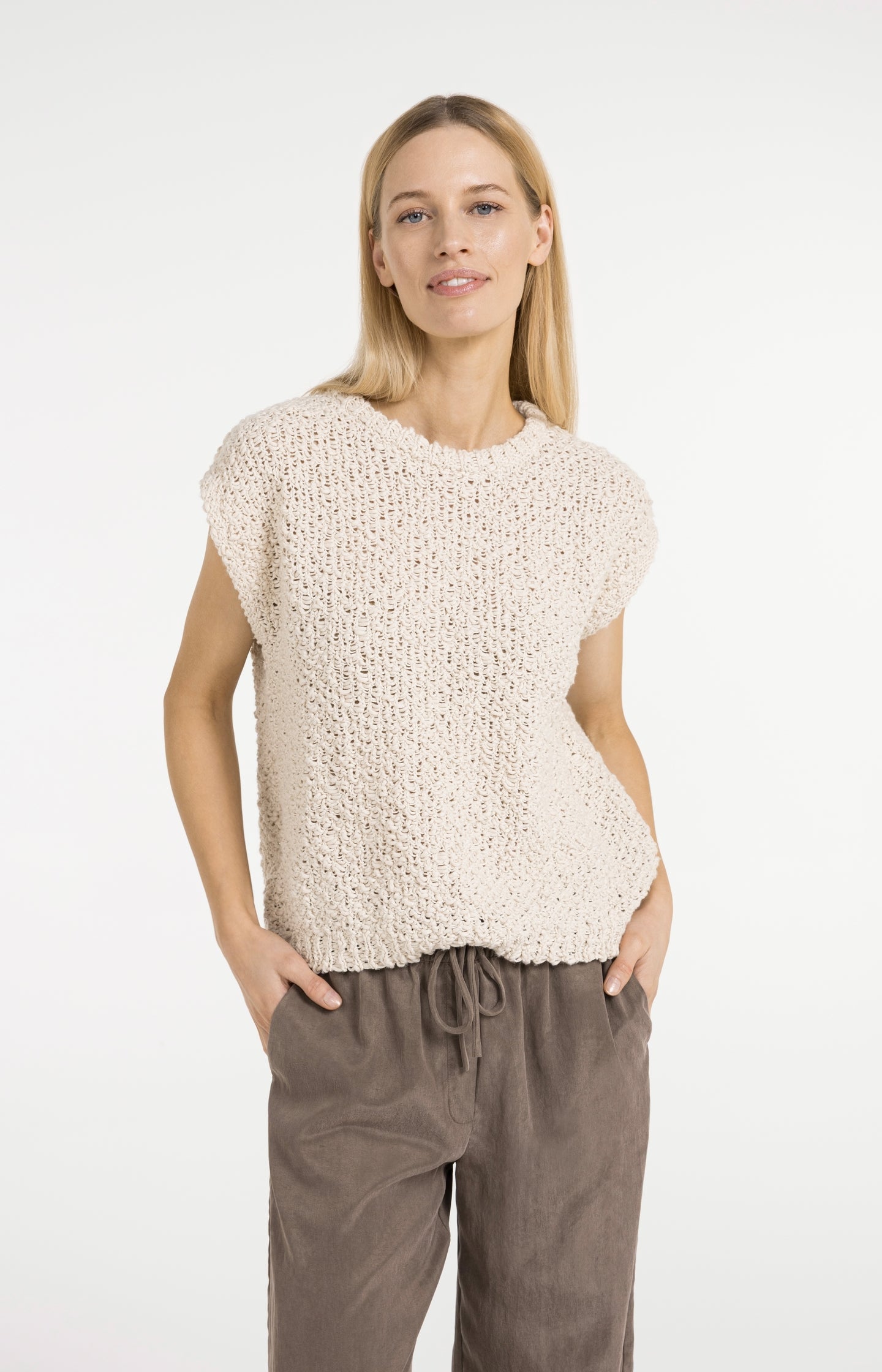 Sleeveless sweater with open-knit texture