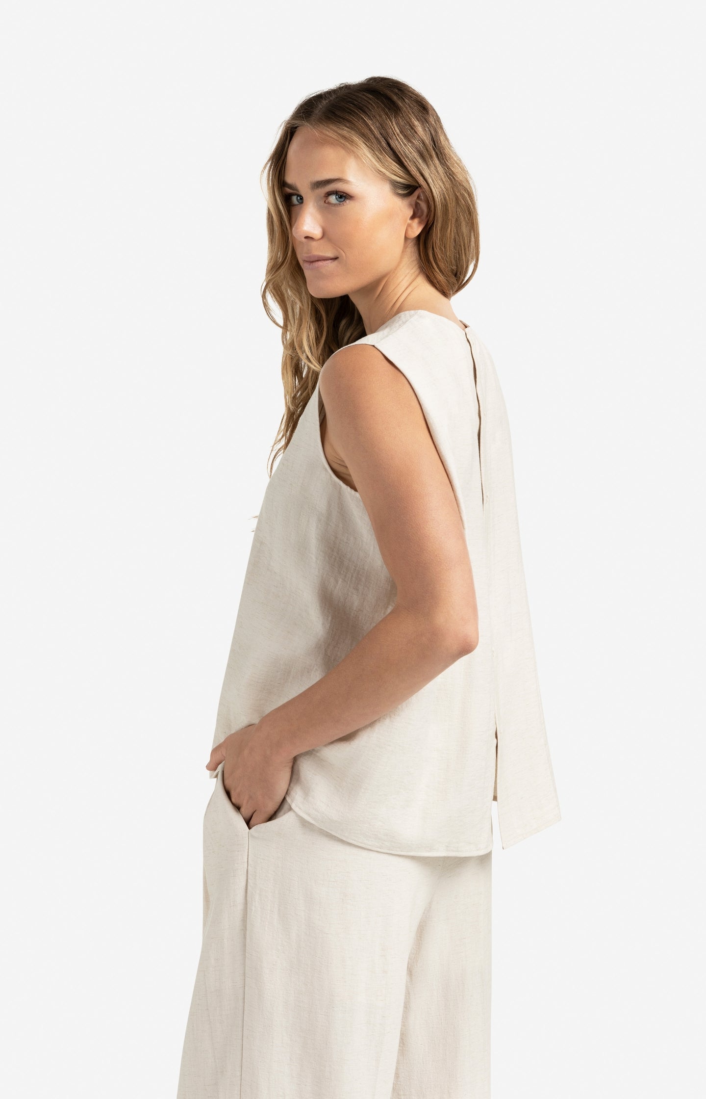 Sleeveless top with button closure on back