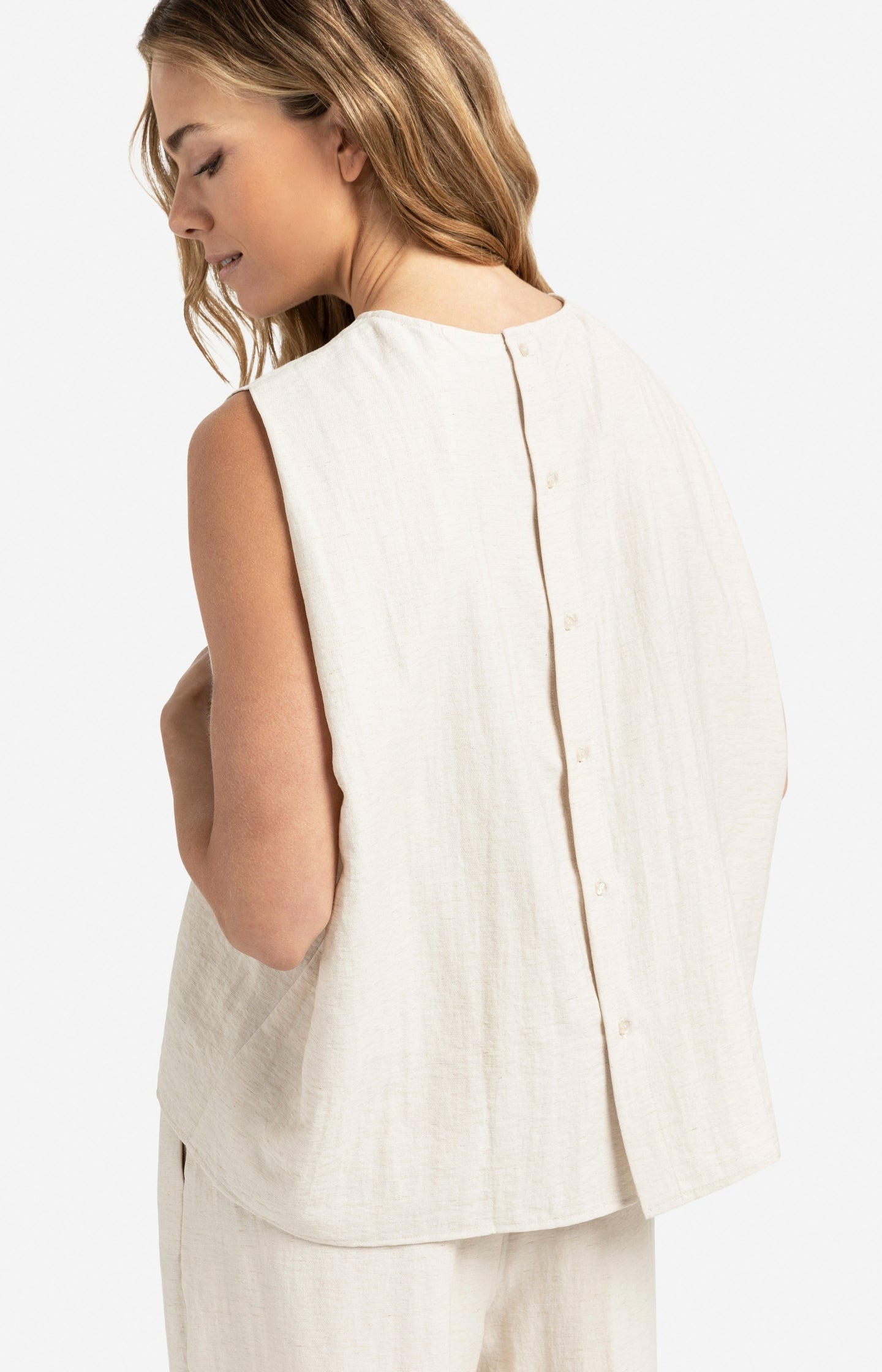 Sleeveless top with button closure on back