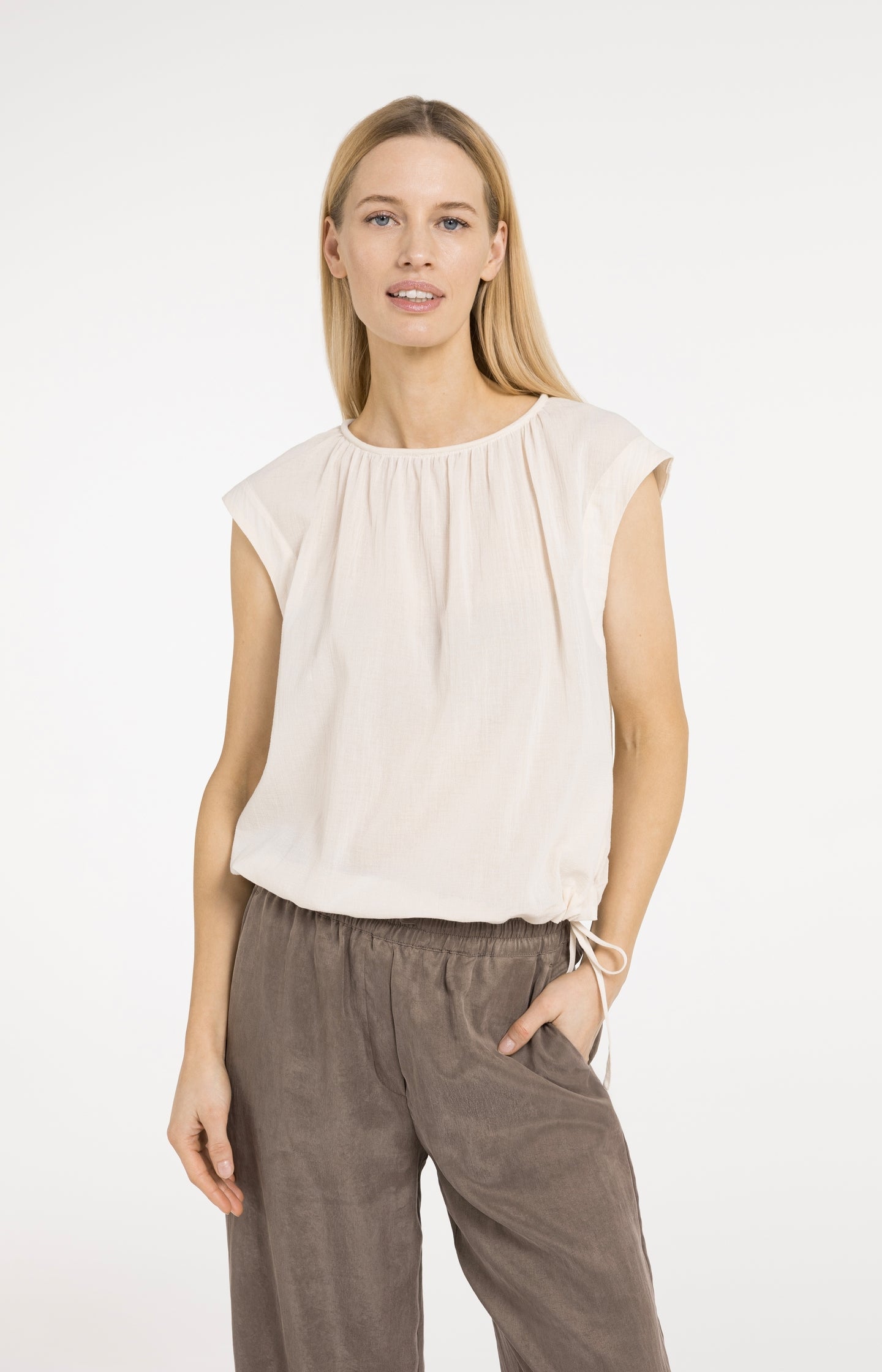 Sleeveless top with pleated neckline and drawstring