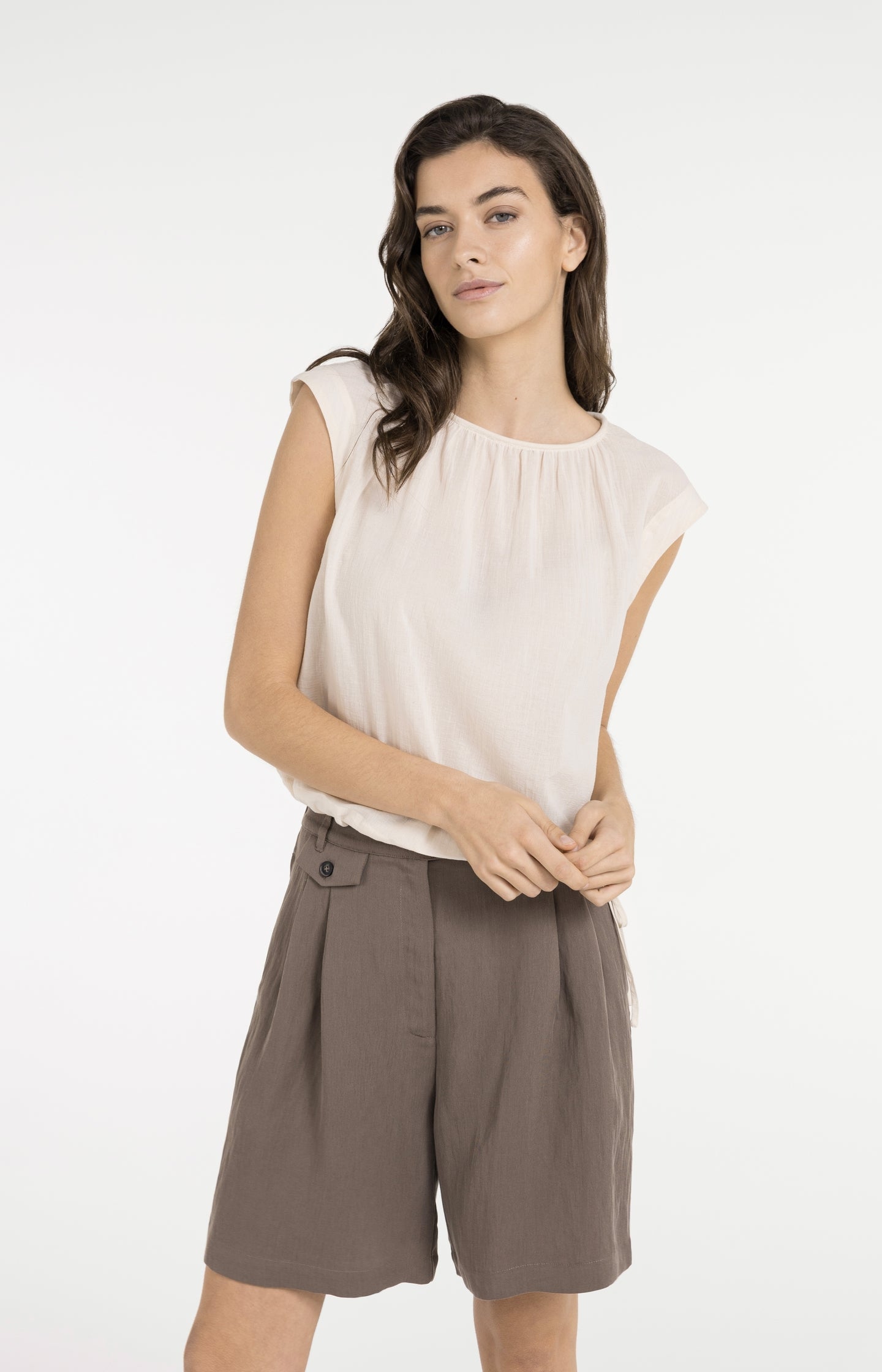 Sleeveless top with pleated neckline and drawstring