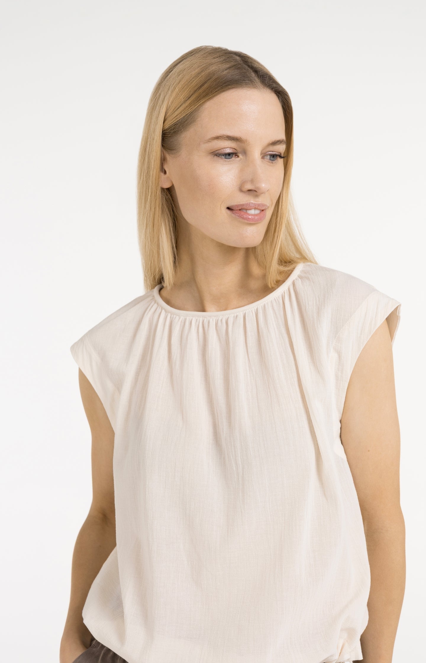 Sleeveless top with pleated neckline and drawstring