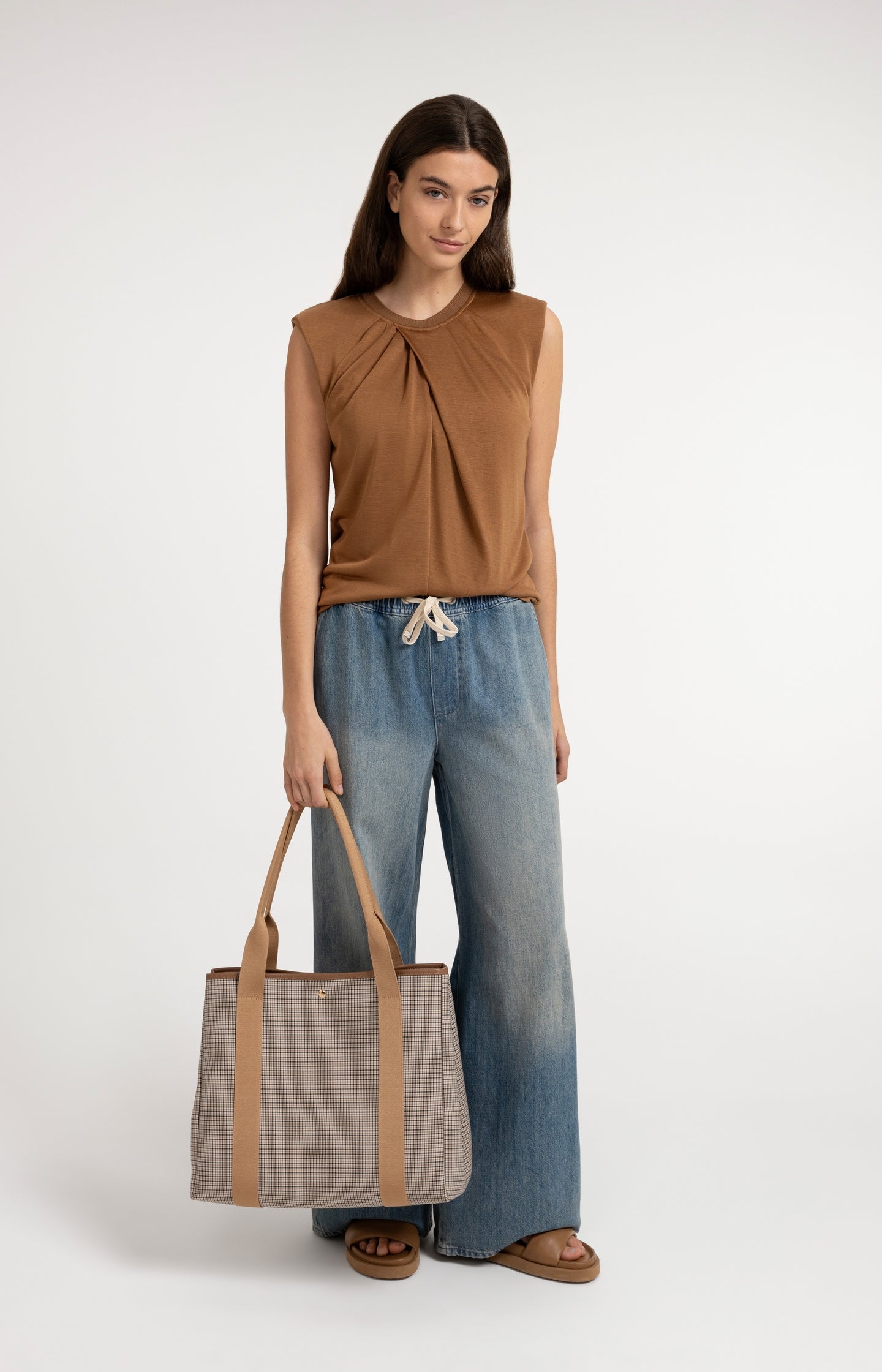 Sleeveless top with pleated neckline detail