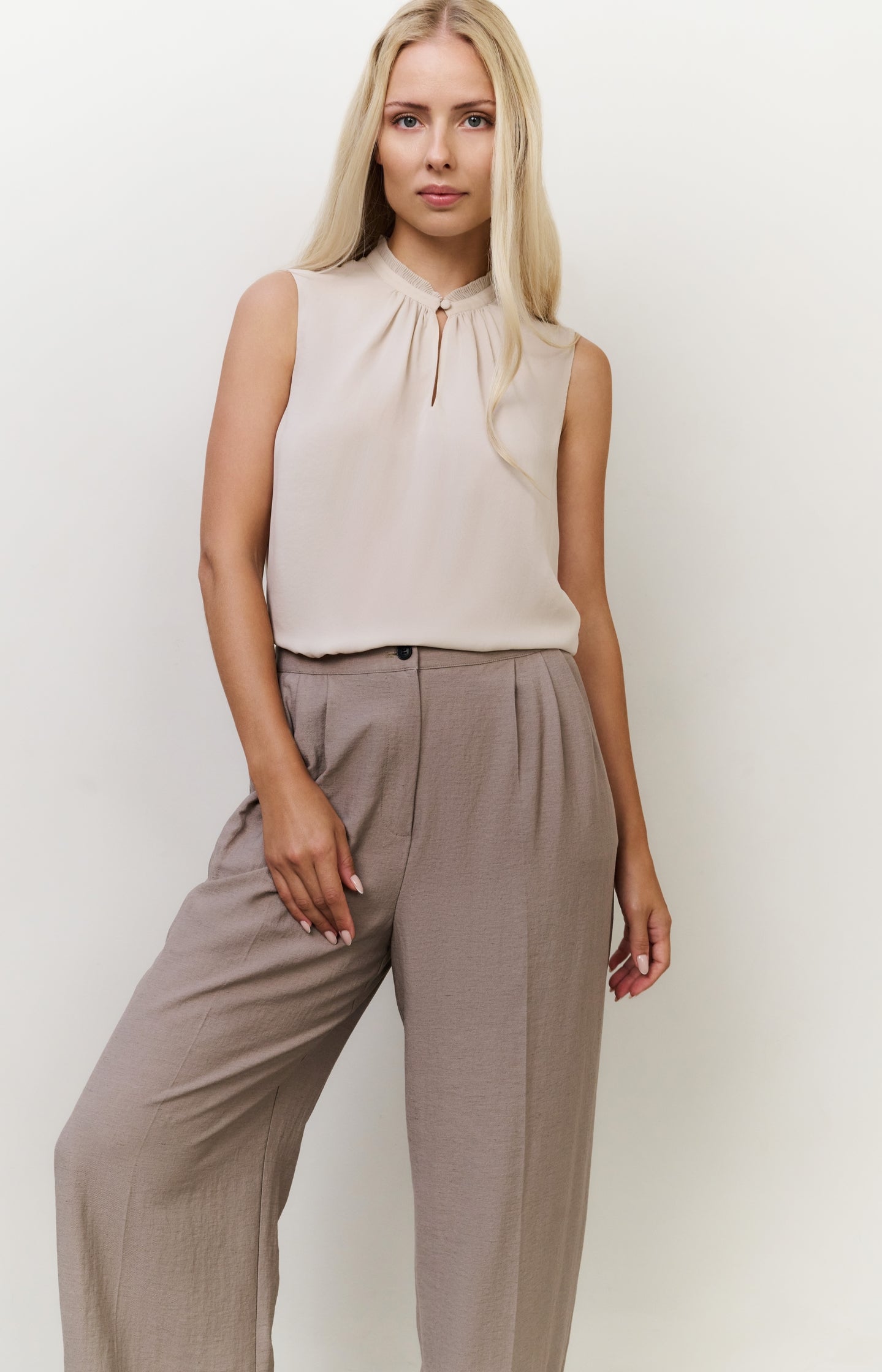 Sleeveless top with ruffled collar and keyhole detail