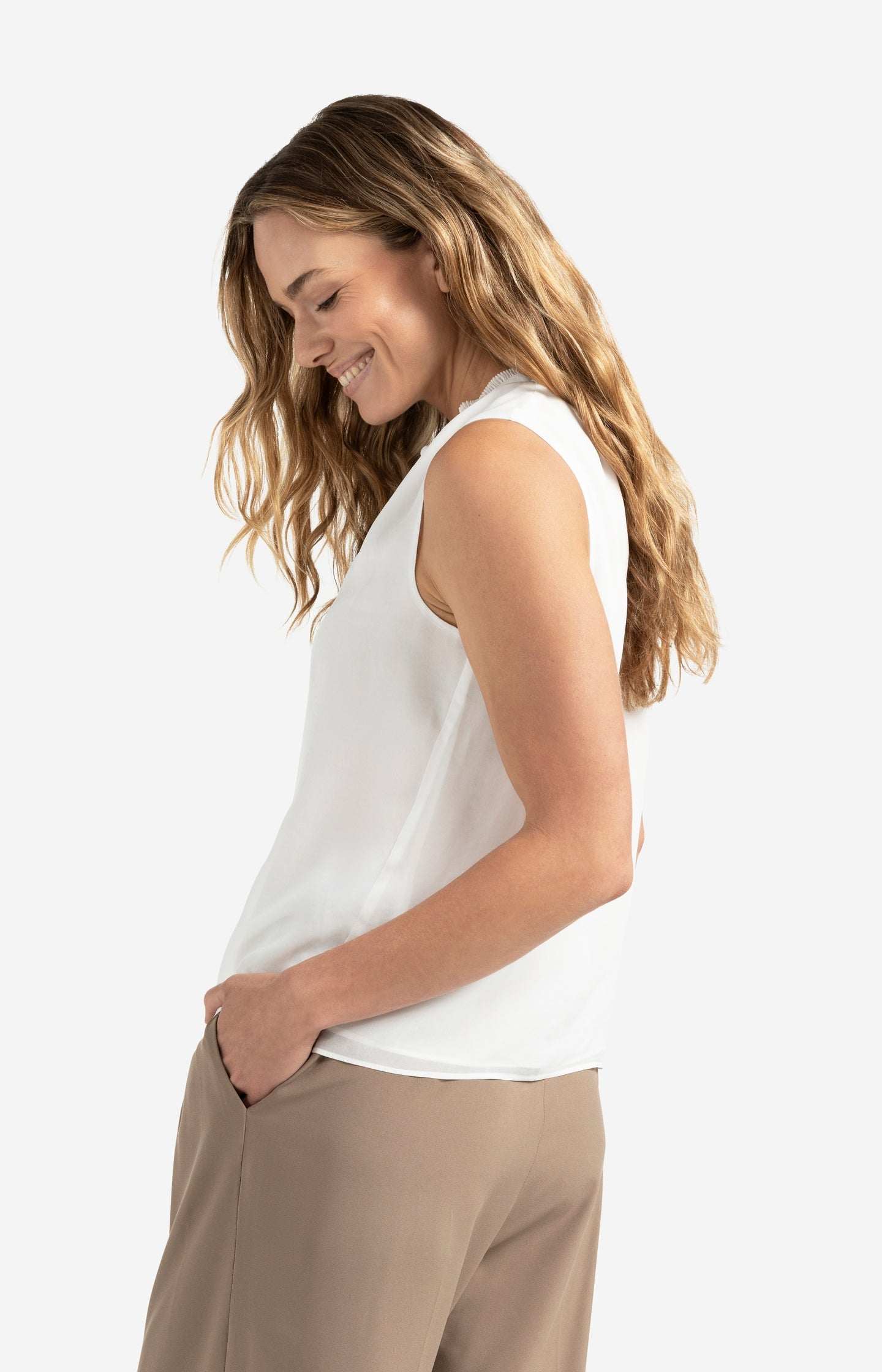 Sleeveless top with ruffled collar and keyhole detail