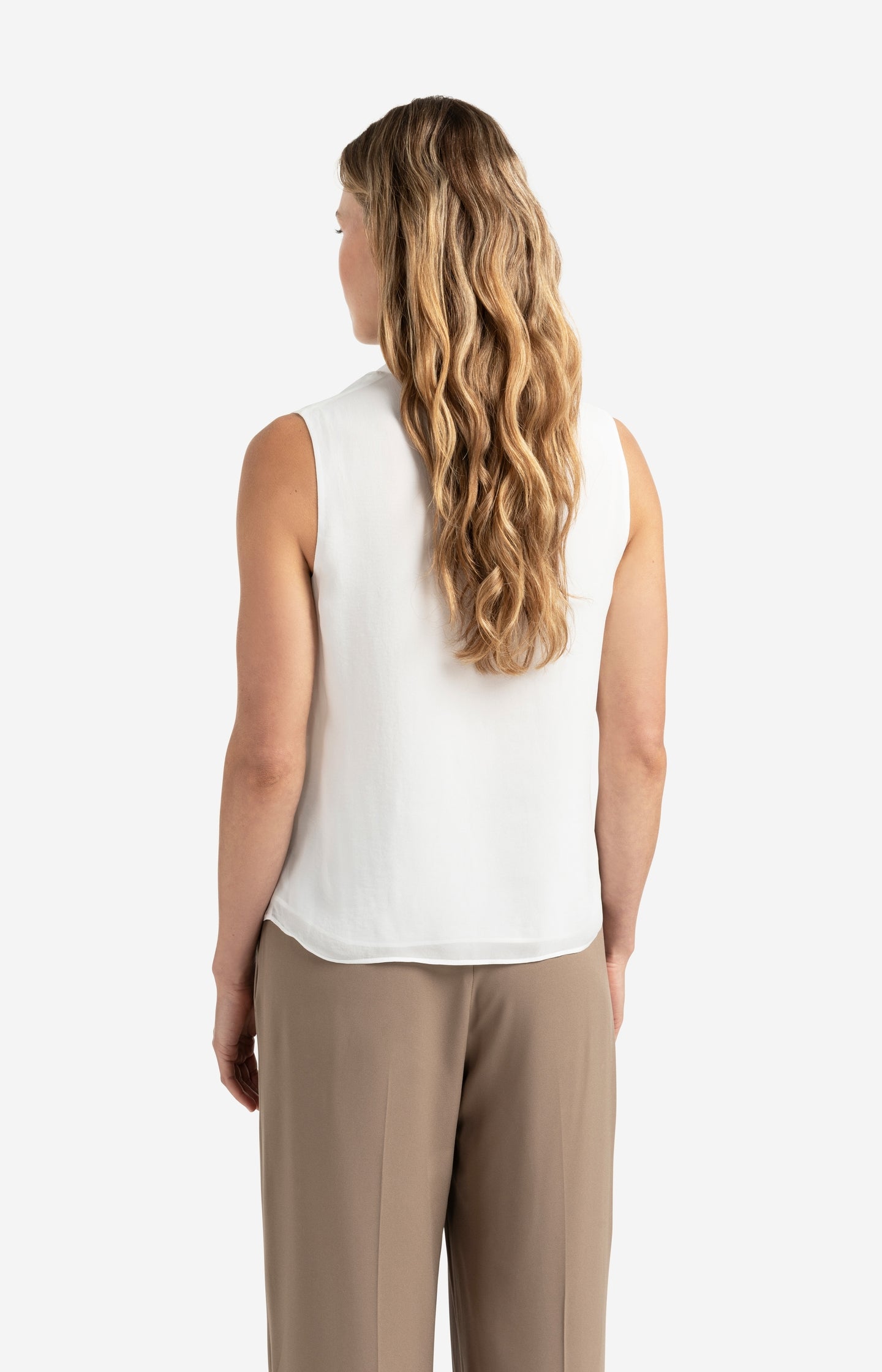 Sleeveless top with ruffled collar and keyhole detail