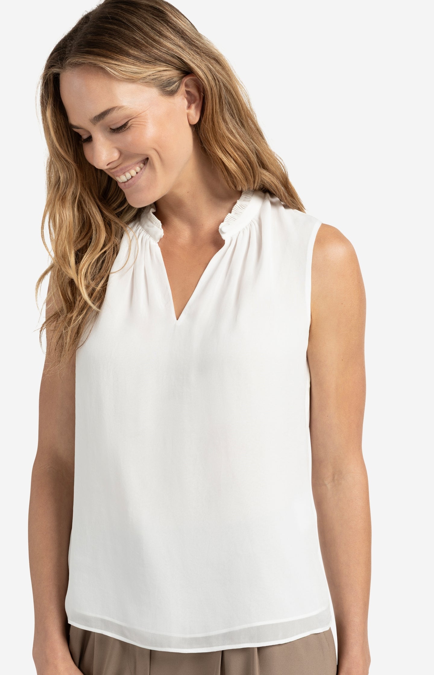 Sleeveless top with ruffled collar and keyhole detail
