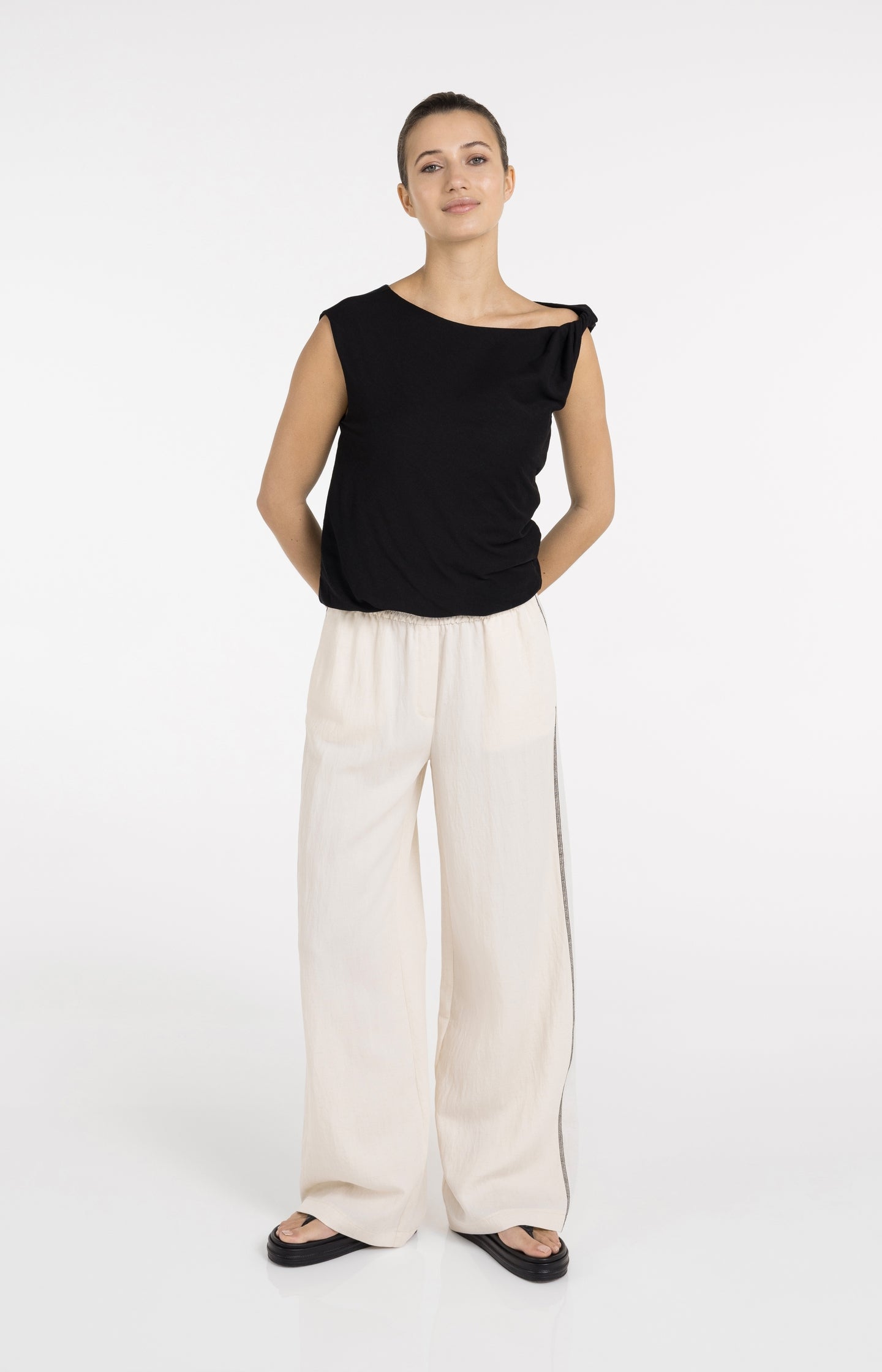 Sleeveless top with twisted shoulder detail
