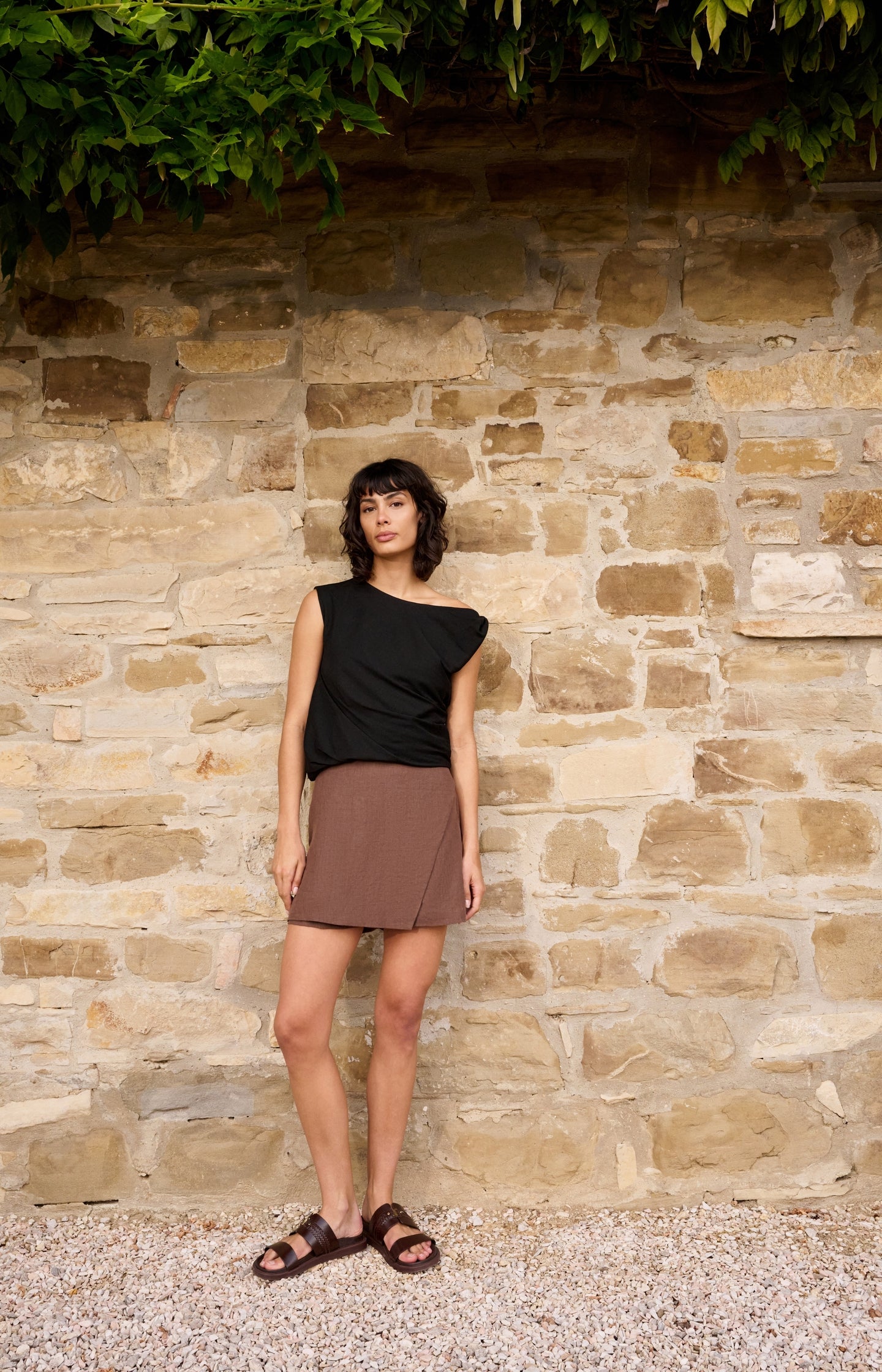 Sleeveless top with twisted shoulder detail