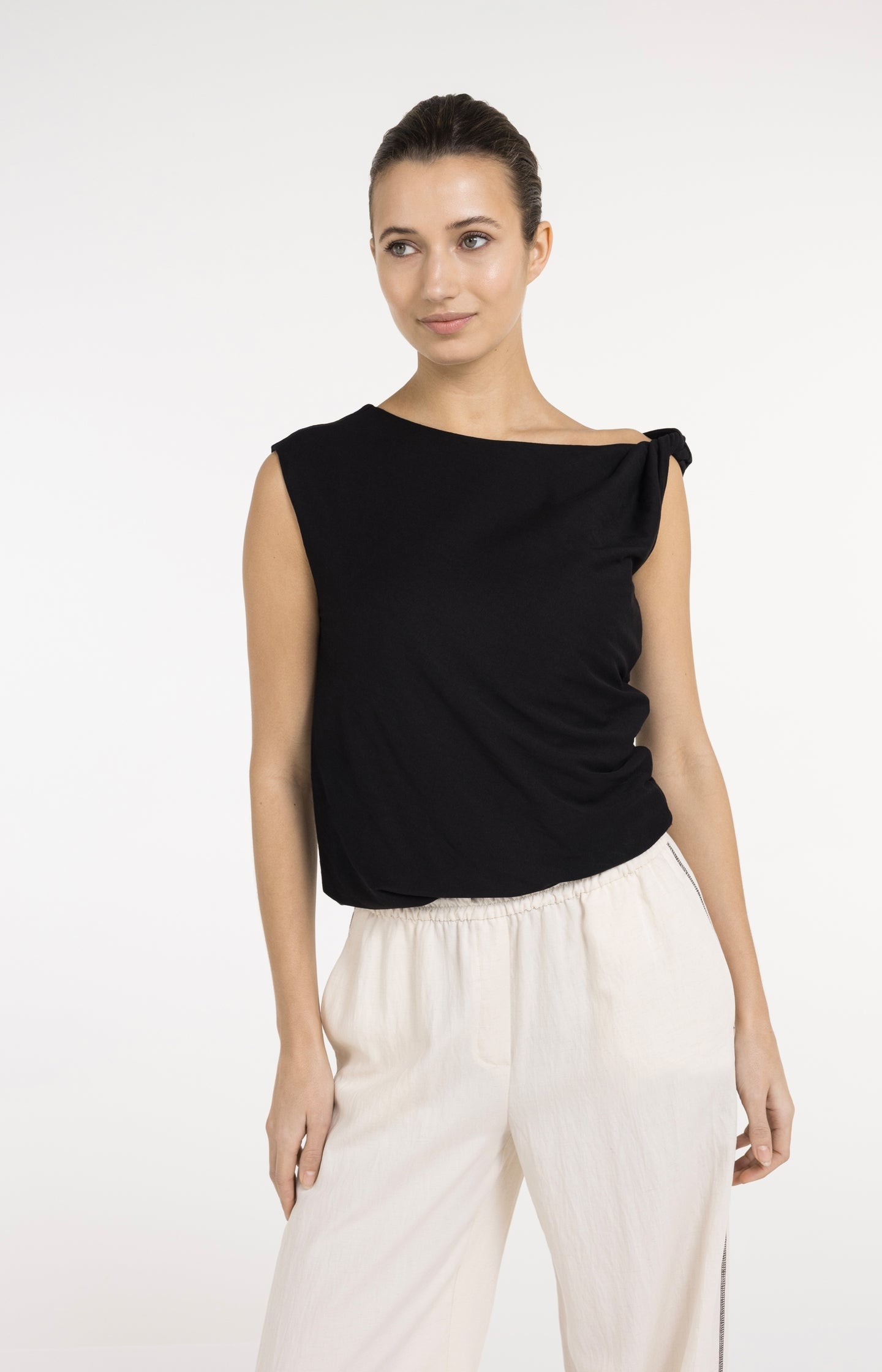 Sleeveless top with twisted shoulder detail
