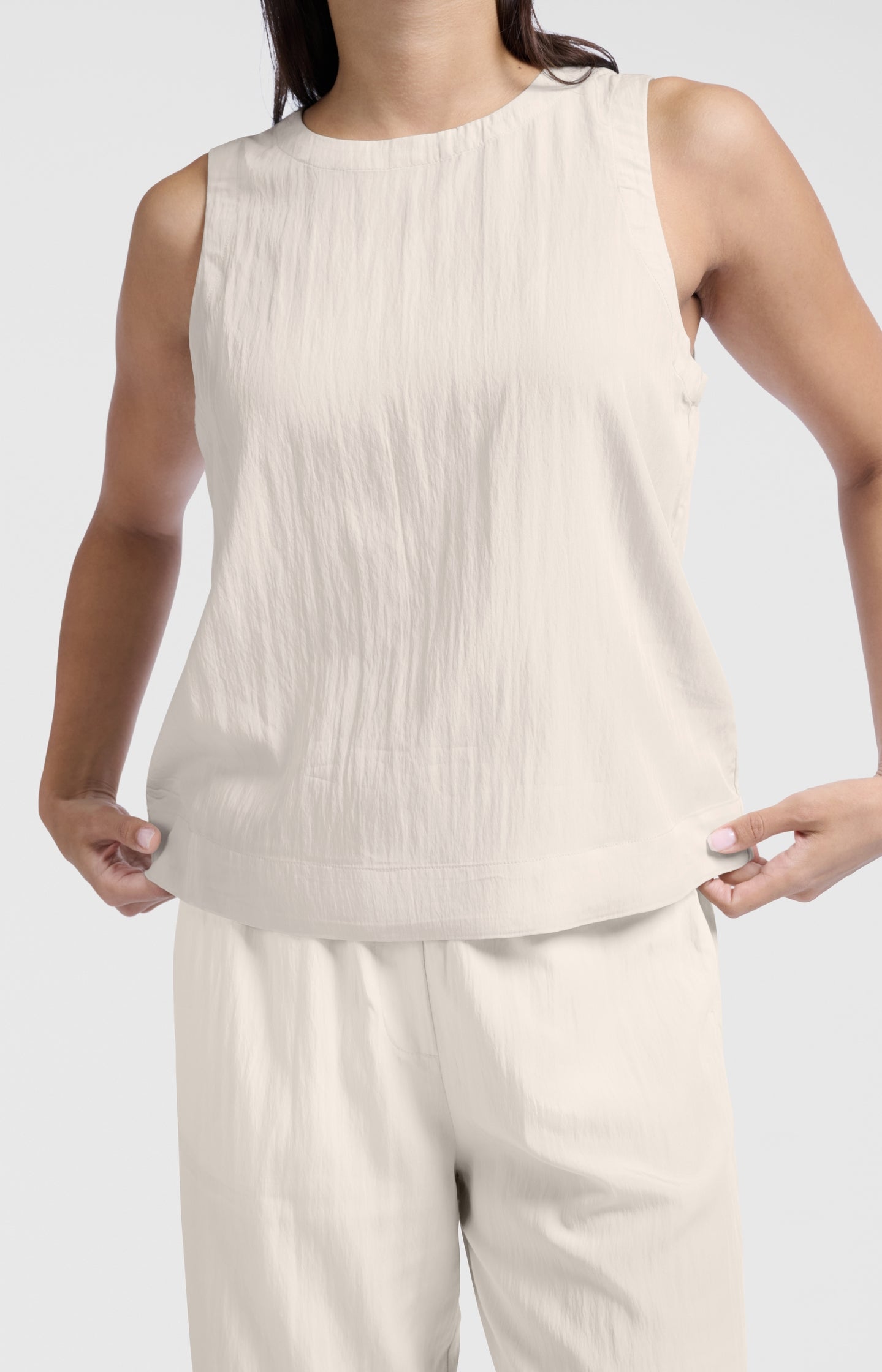 Sleeveless woven top with round neckline