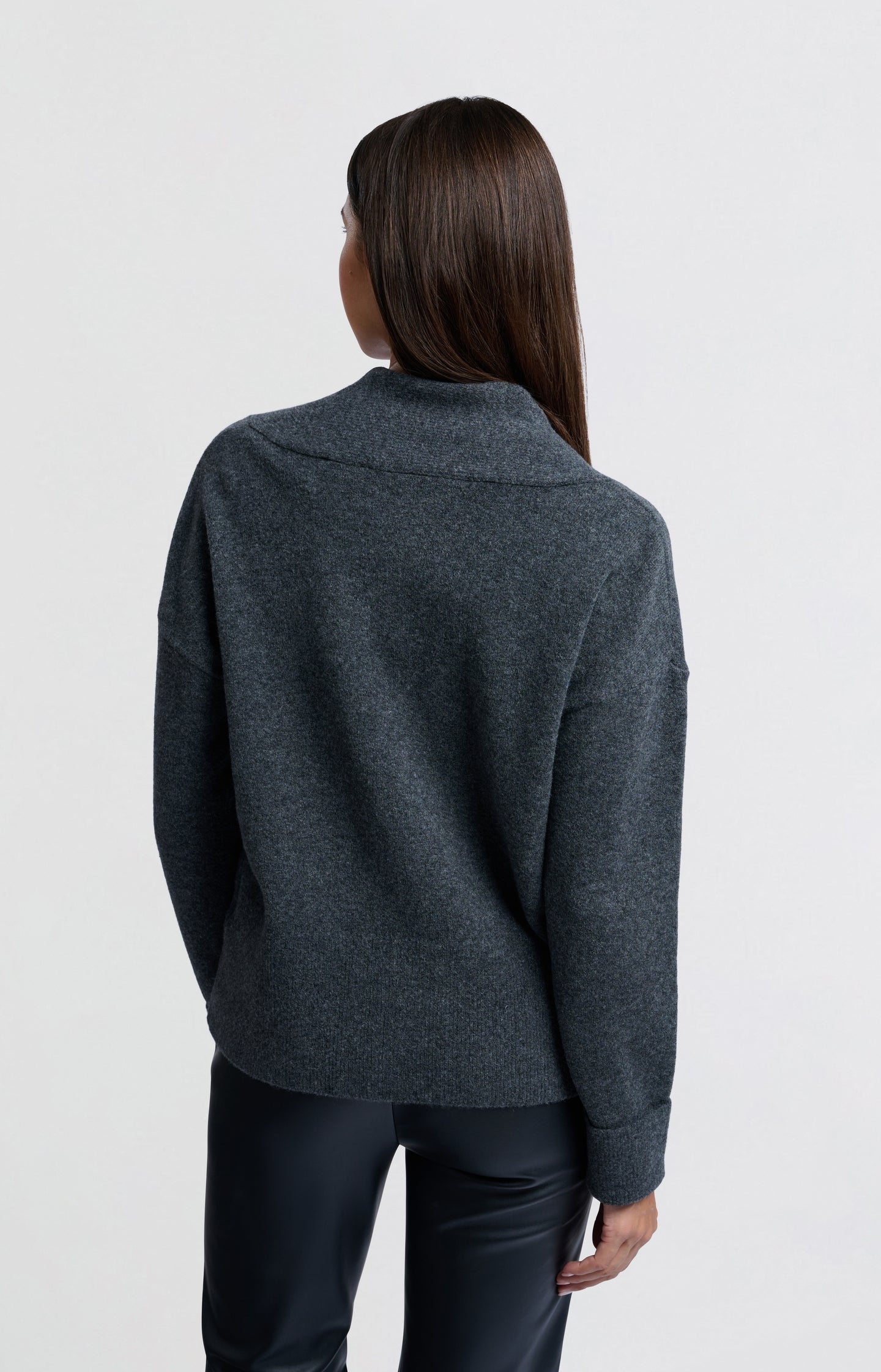 Soft sweater with deep V-neck and subtle rib details