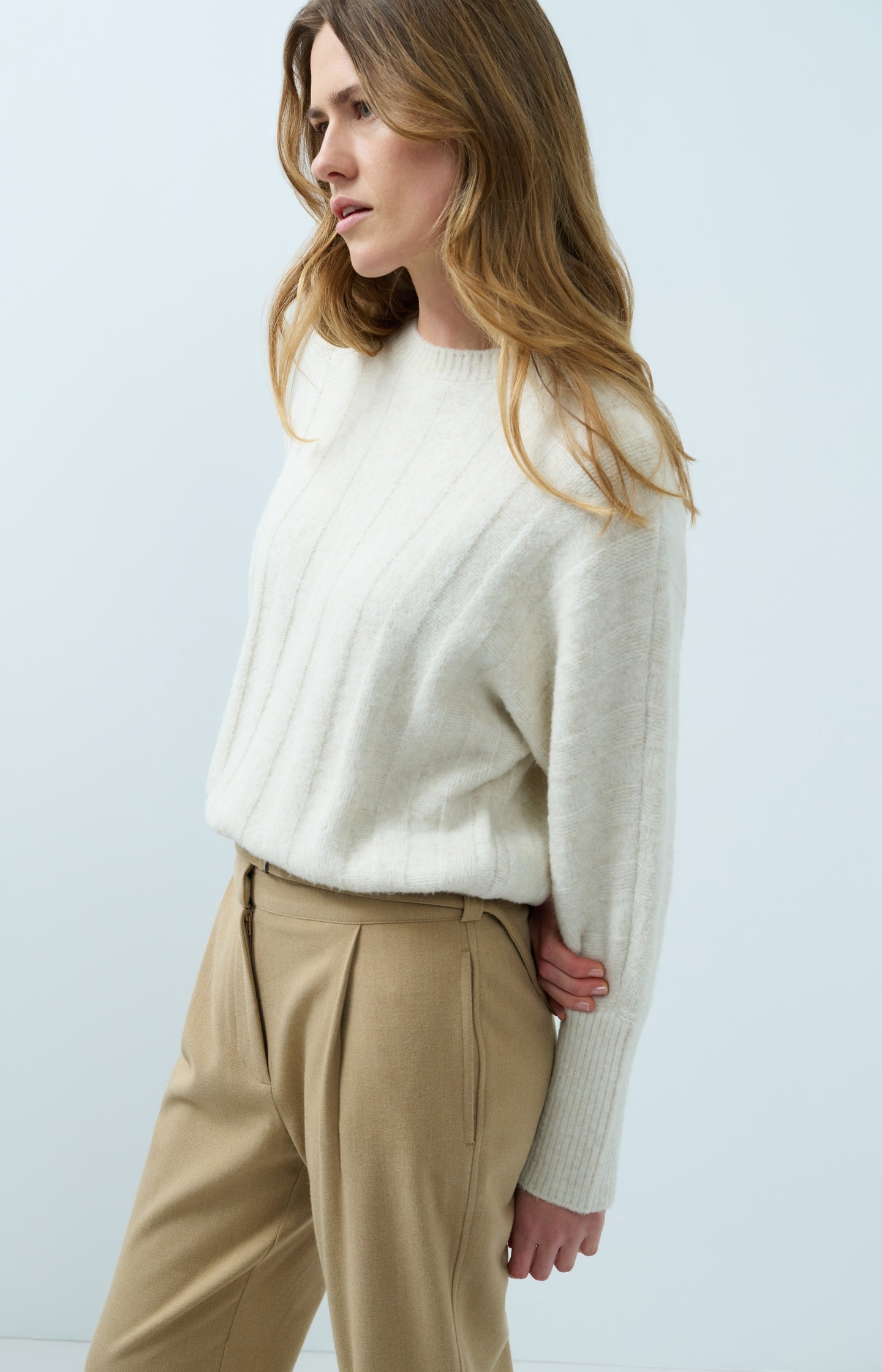 Sweater with batwing sleeves and drawcord at the hem