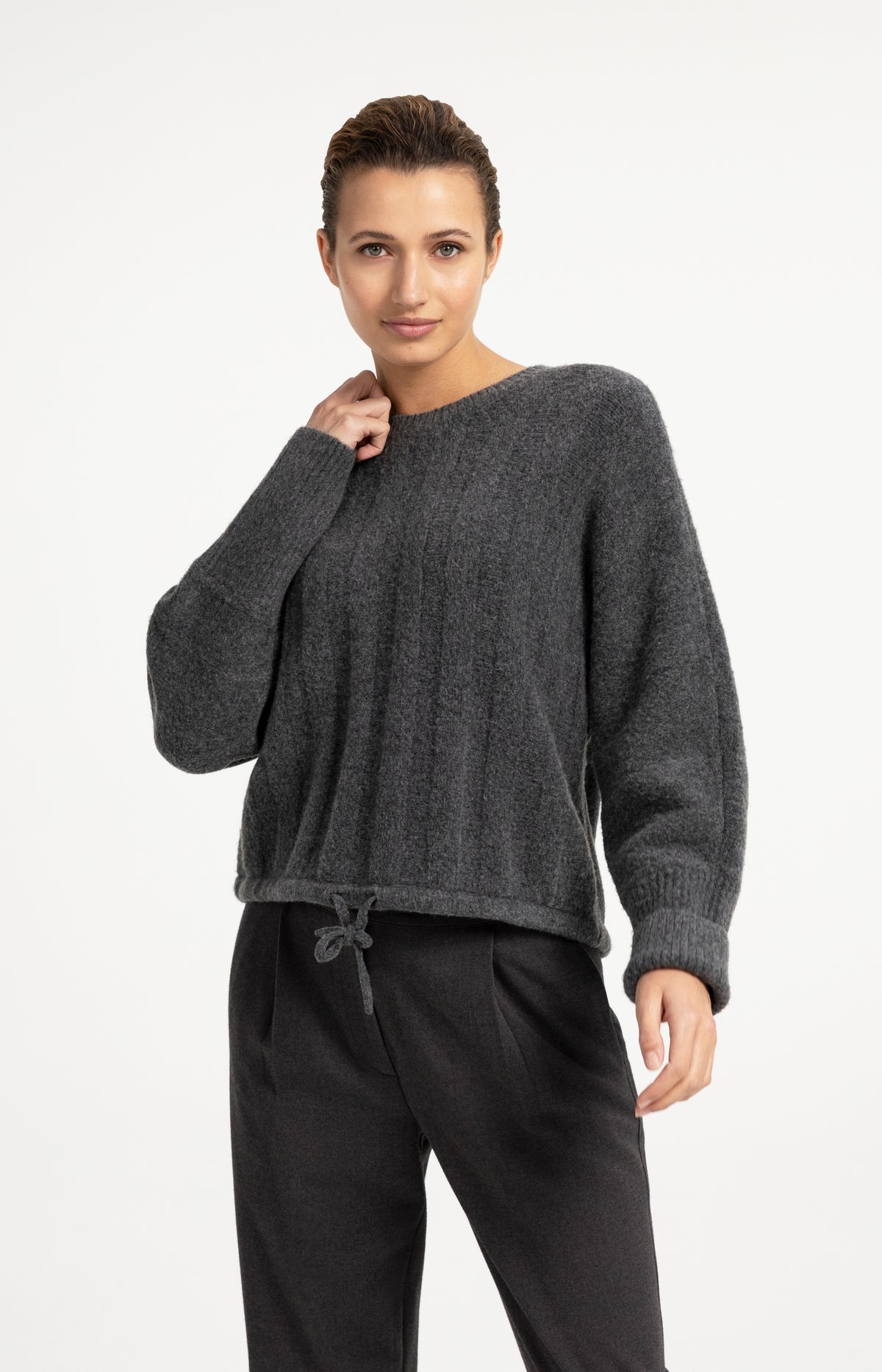 Sweater with batwing sleeves and drawcord at the hem