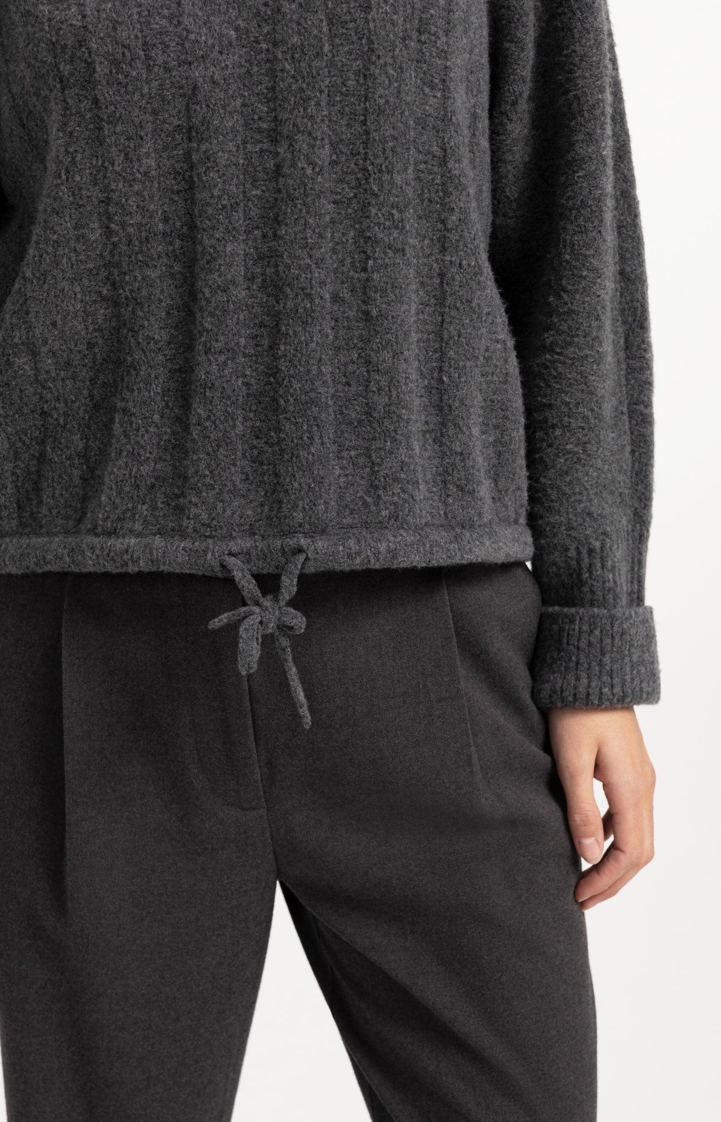 Sweater with batwing sleeves and drawcord at the hem