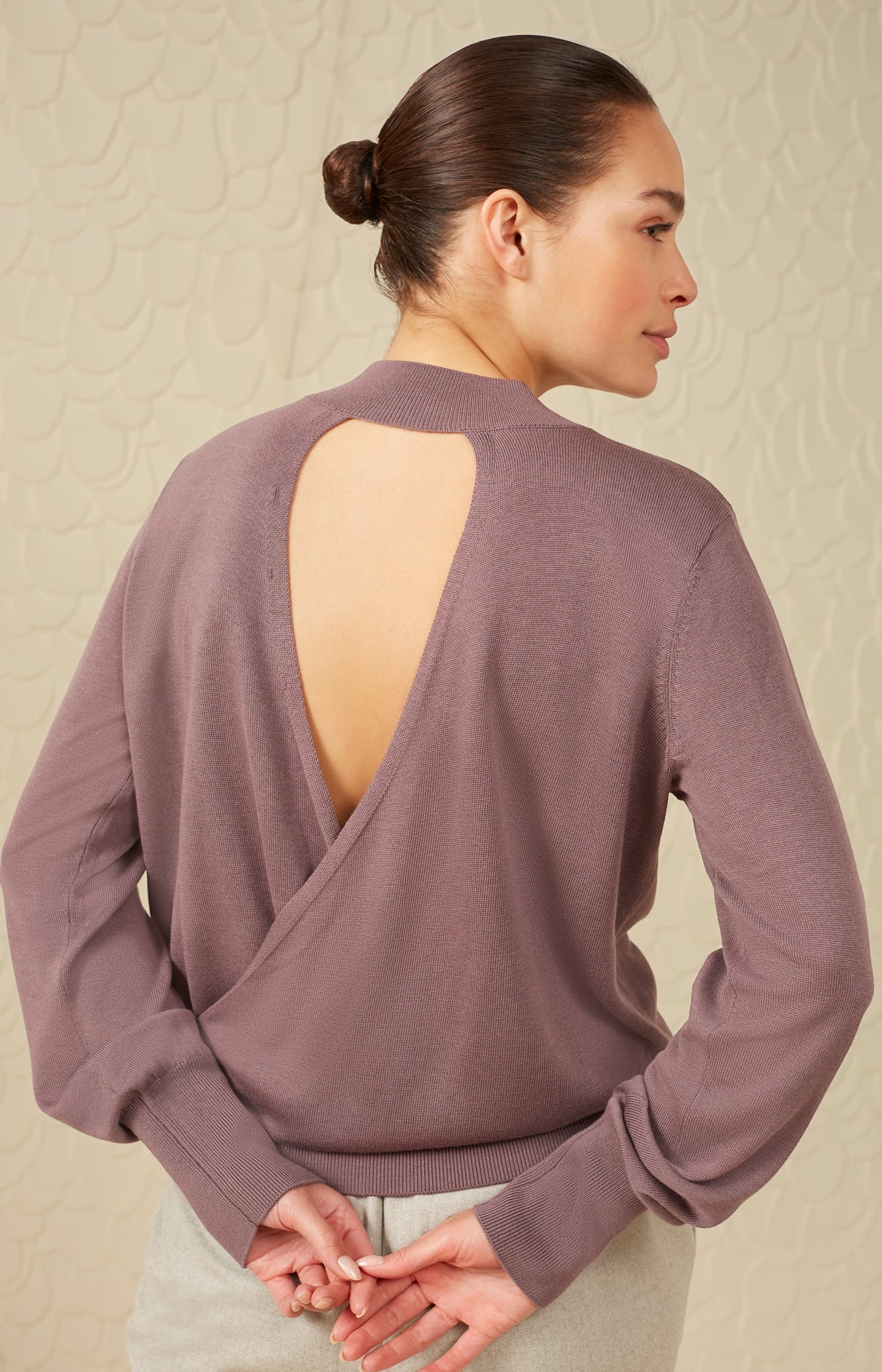 Sweater with high neck long sleeves and open back