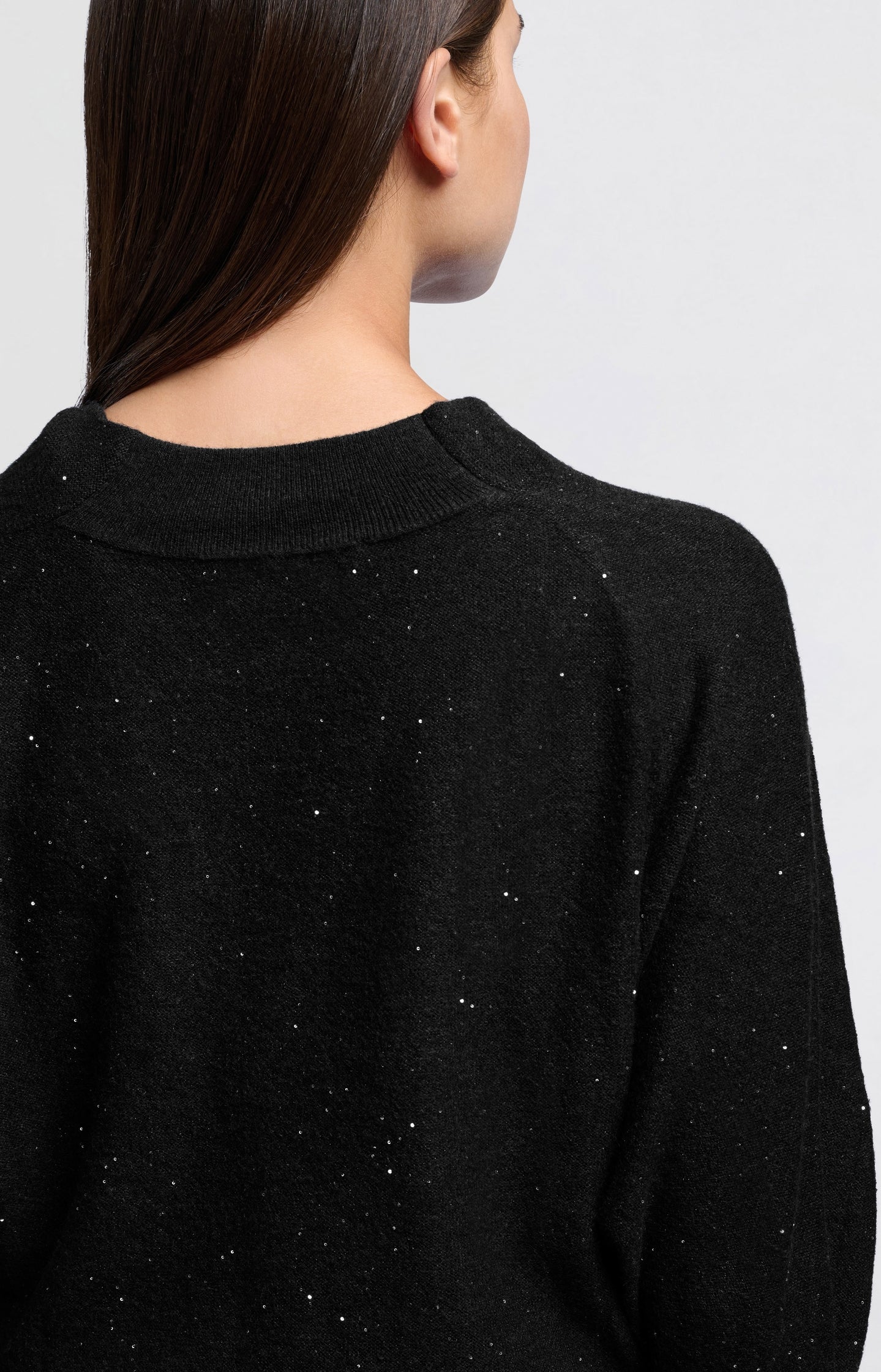 Sweater with turtleneck, batwing sleeves and glitter sequins