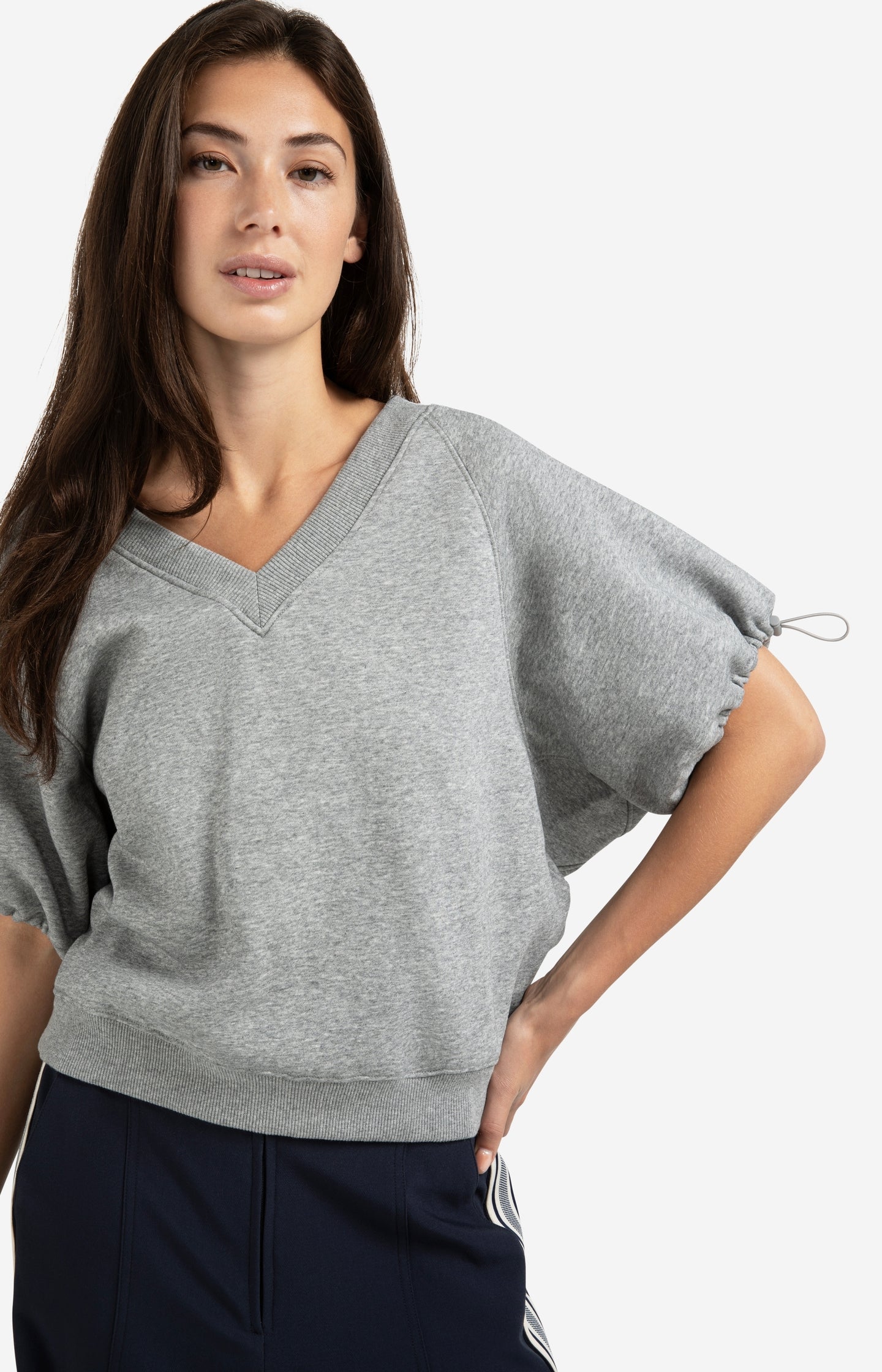 Sweatshirt with V-neck and adjustable sleeve cords