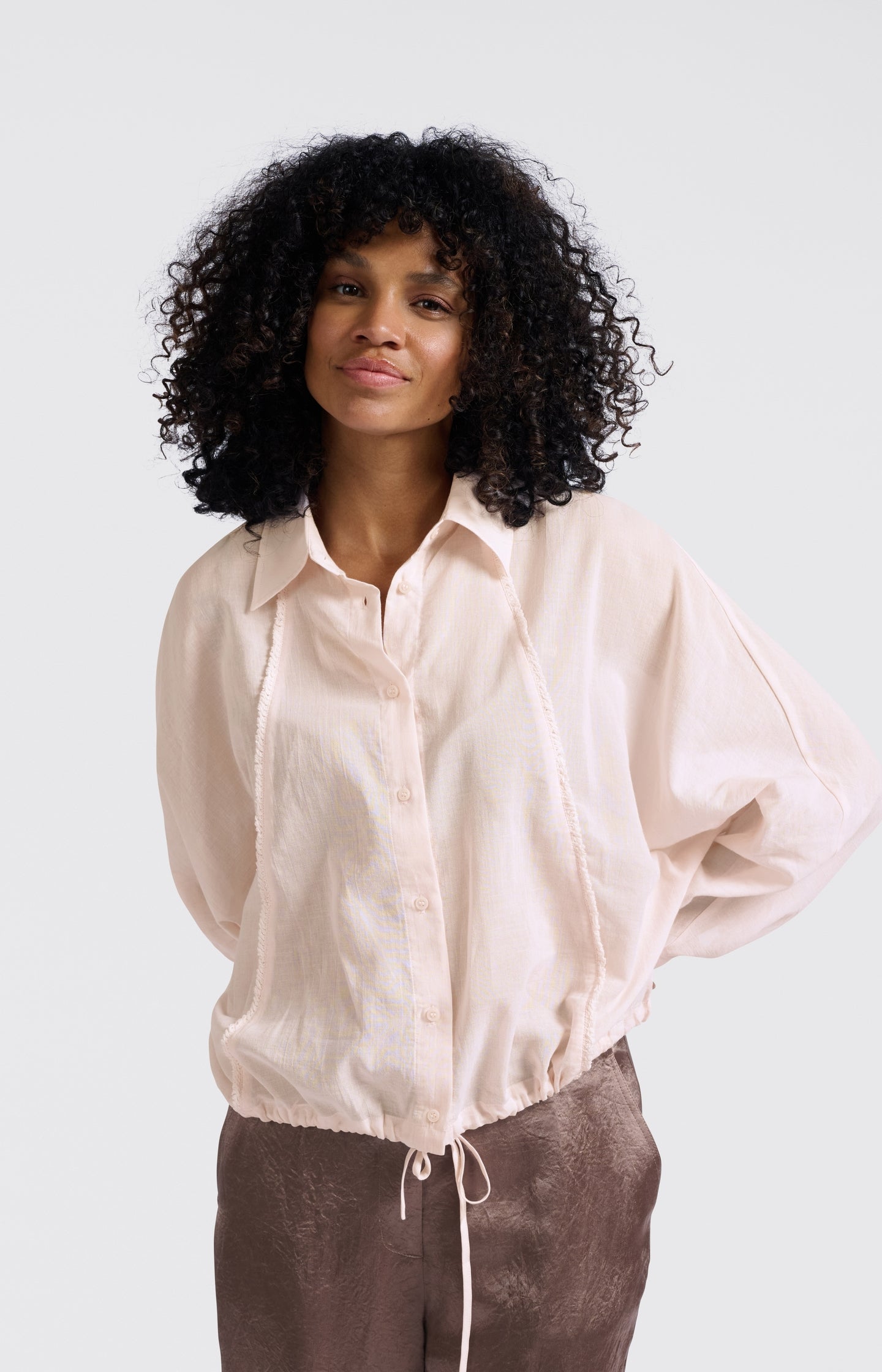 Textured blouse with decorative seams and regular fit