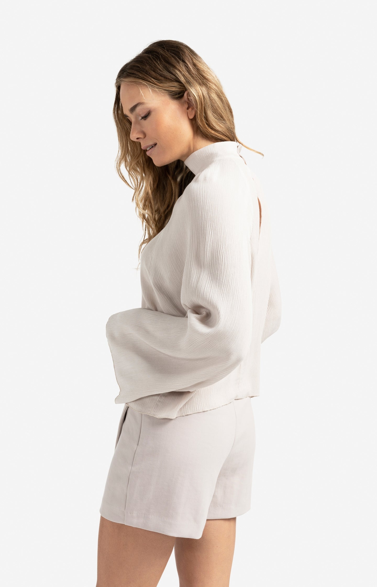 Textured top with high neck and raglan sleeves