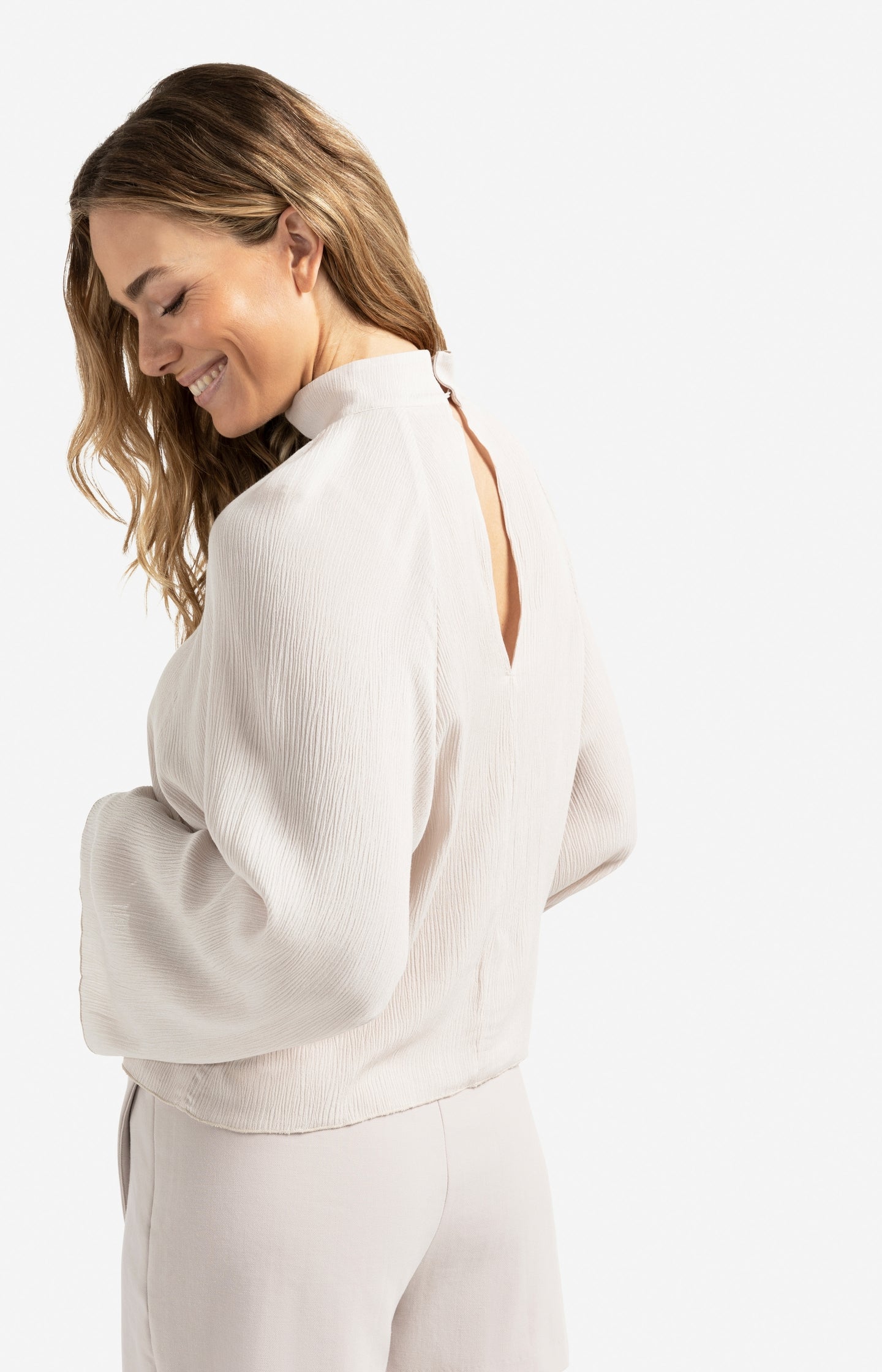 Textured top with high neck and raglan sleeves