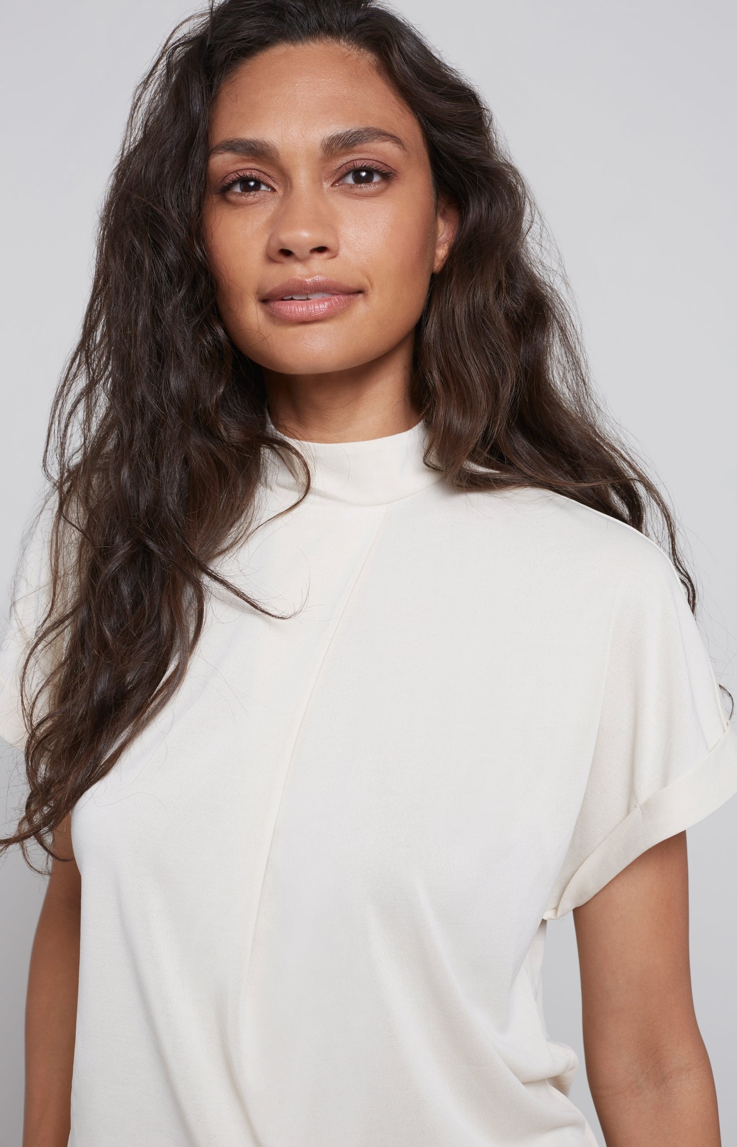 Top with high round neck, short sleeves and pleat detail - Type: lookbook