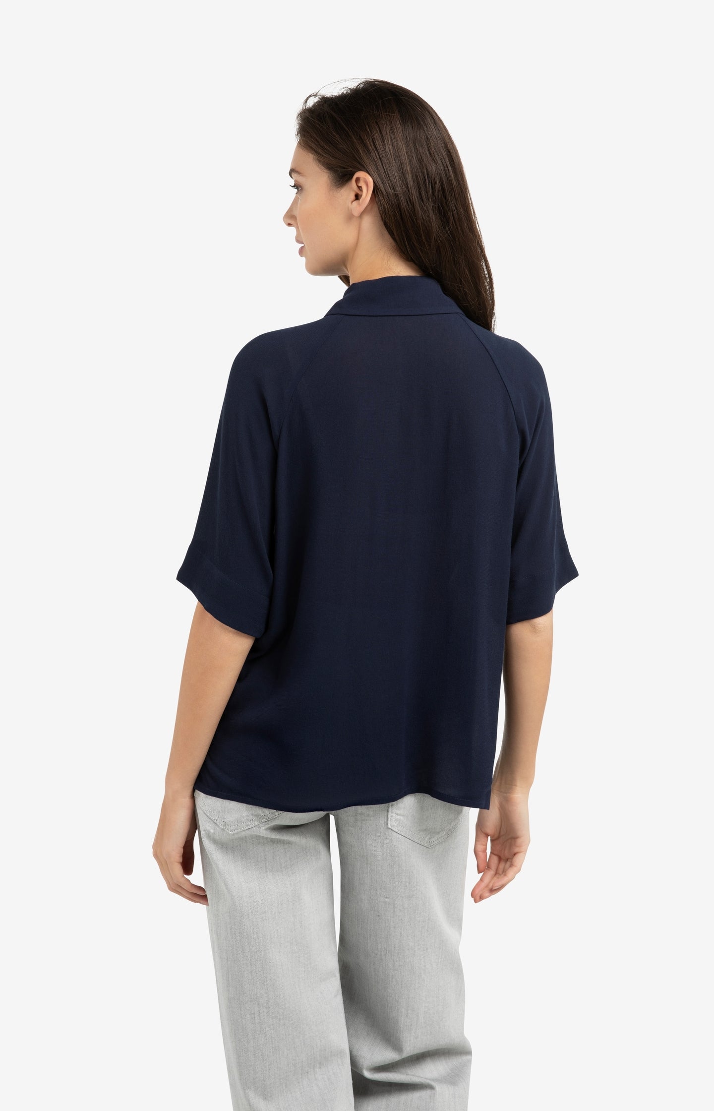 Top with short raglan sleeves and pearl detail