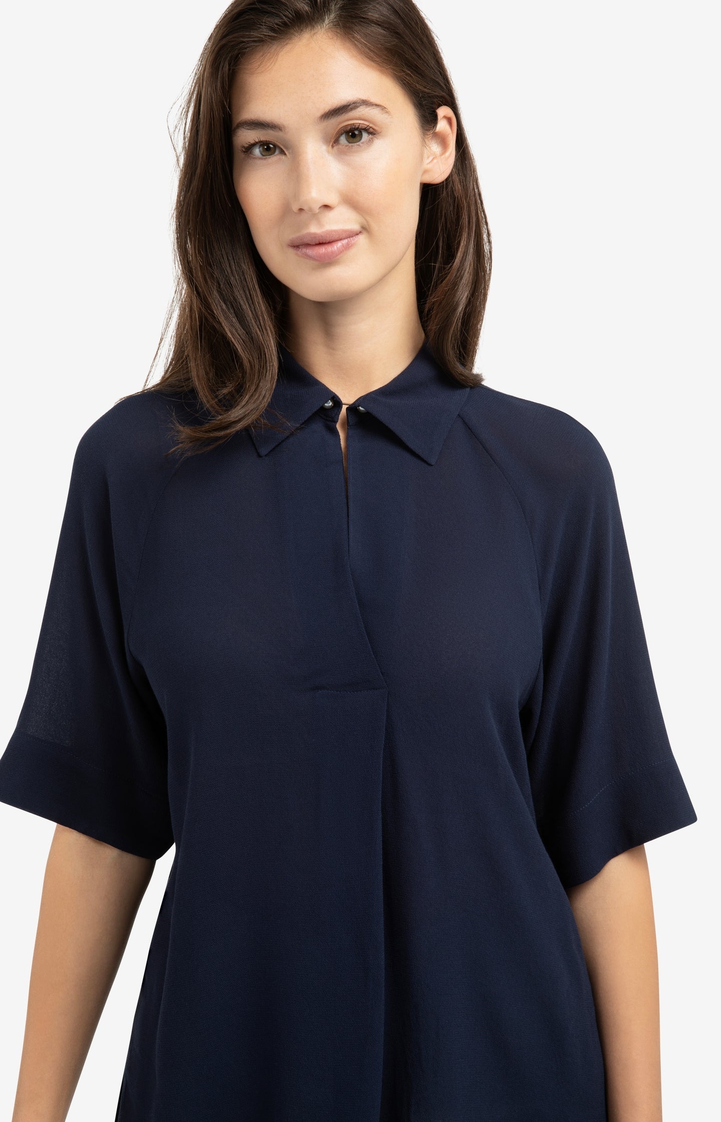Top with short raglan sleeves and pearl detail