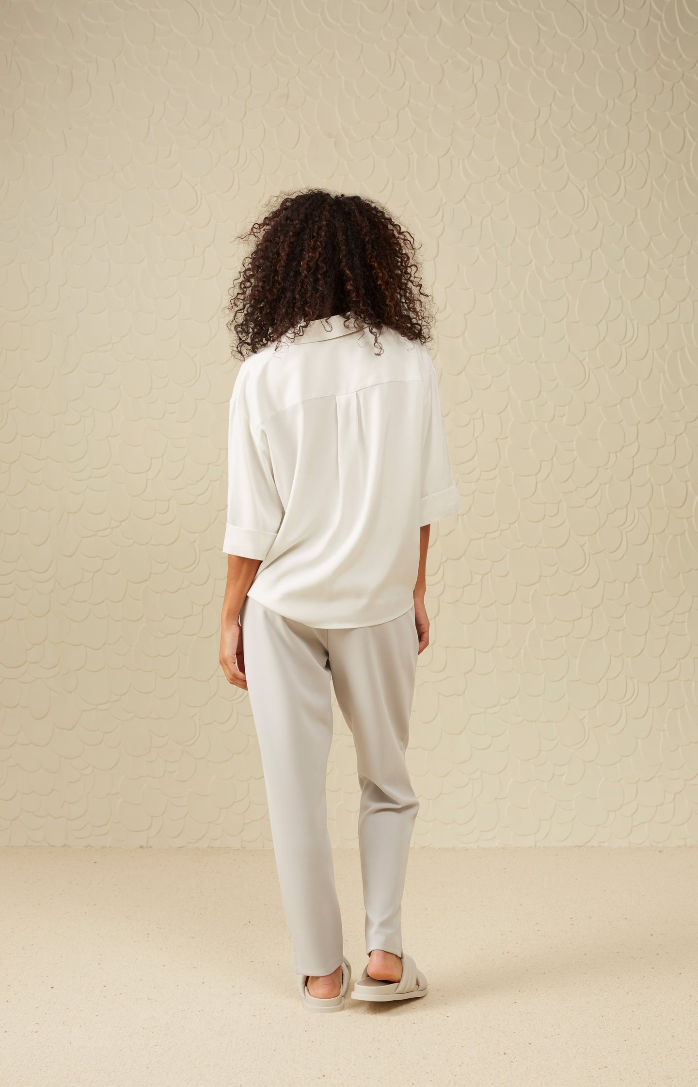 Top with V-neck, 3/4 length sleeves and draped details