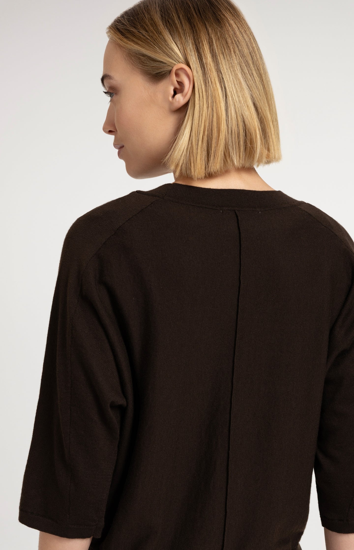V-neck sweater with three-quarter sleeves and seam details