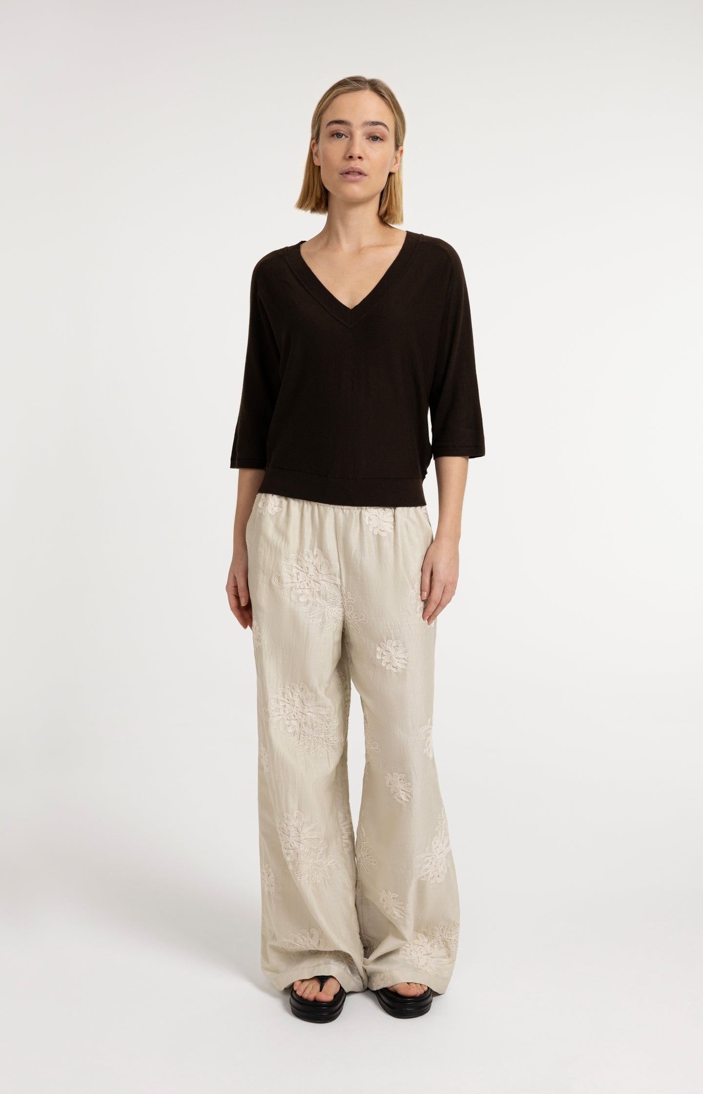 V-neck sweater with three-quarter sleeves and seam details