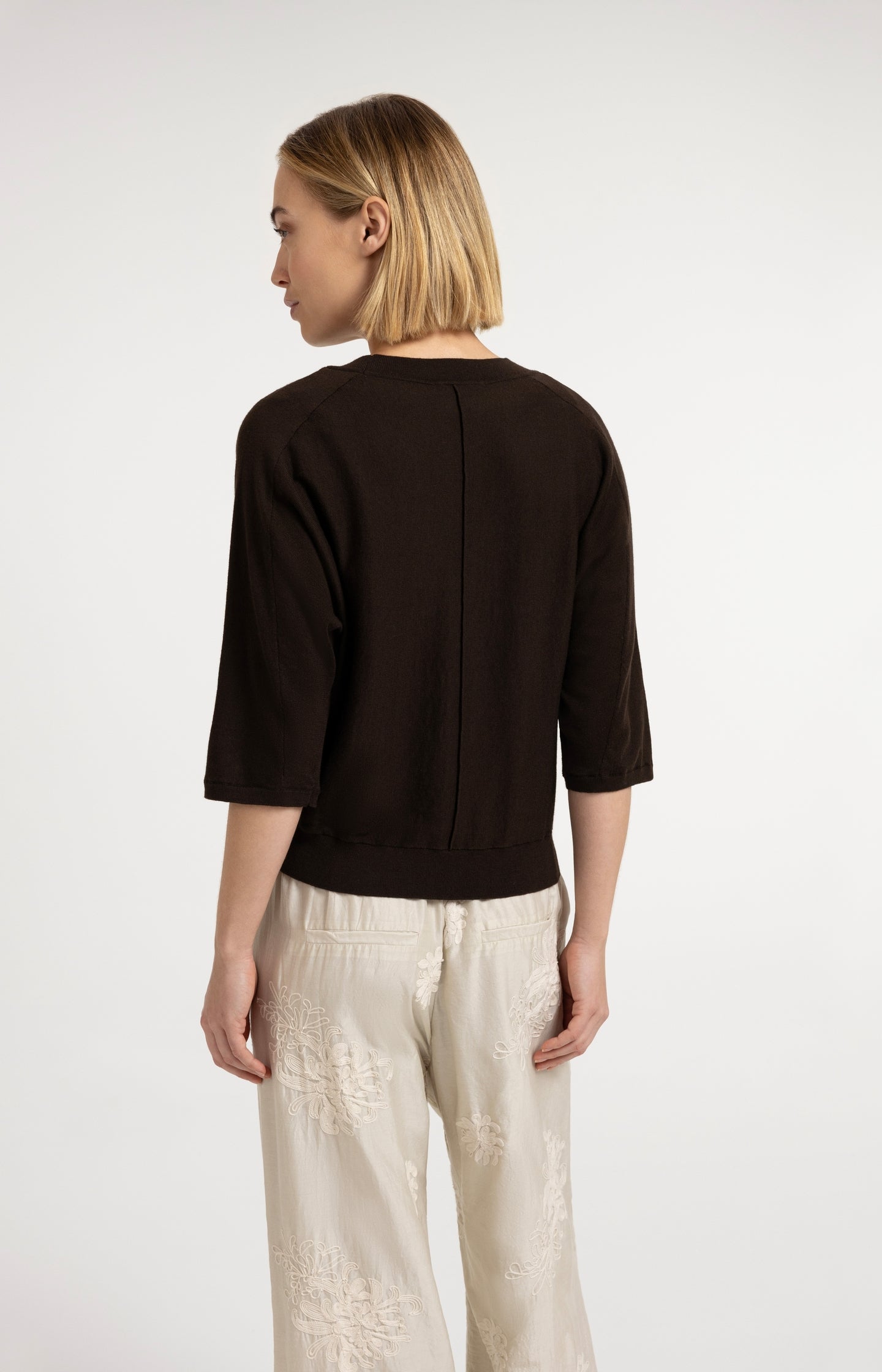 V-neck sweater with three-quarter sleeves and seam details