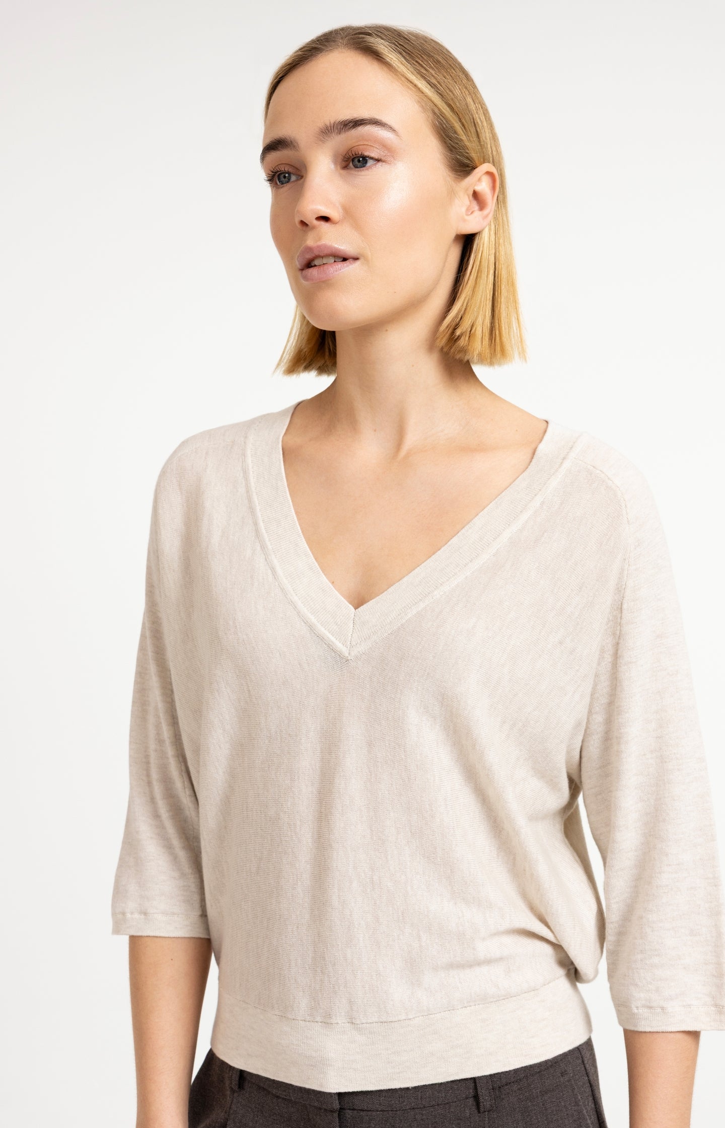 V-neck sweater with three-quarter sleeves and seam details