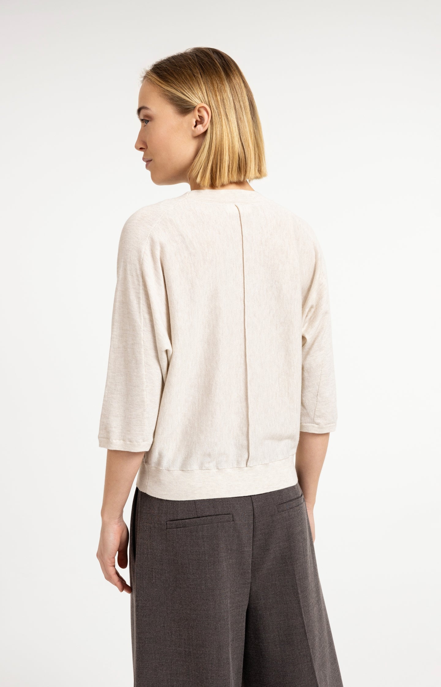 V-neck sweater with three-quarter sleeves and seam details