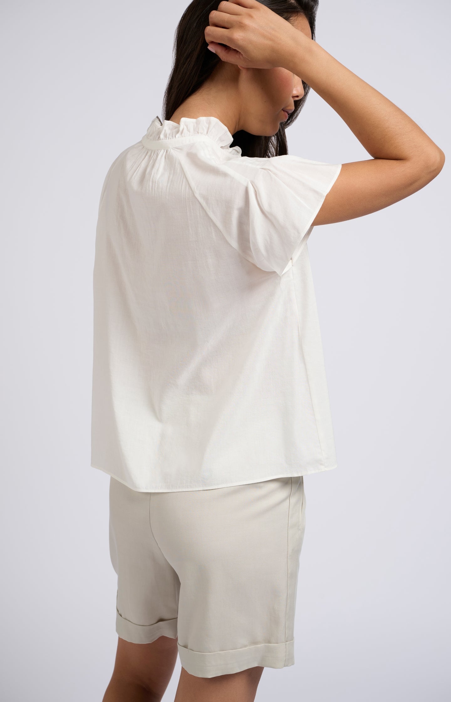 Woven top with high ruffled neck and short sleeves - Blanc De Blanc White